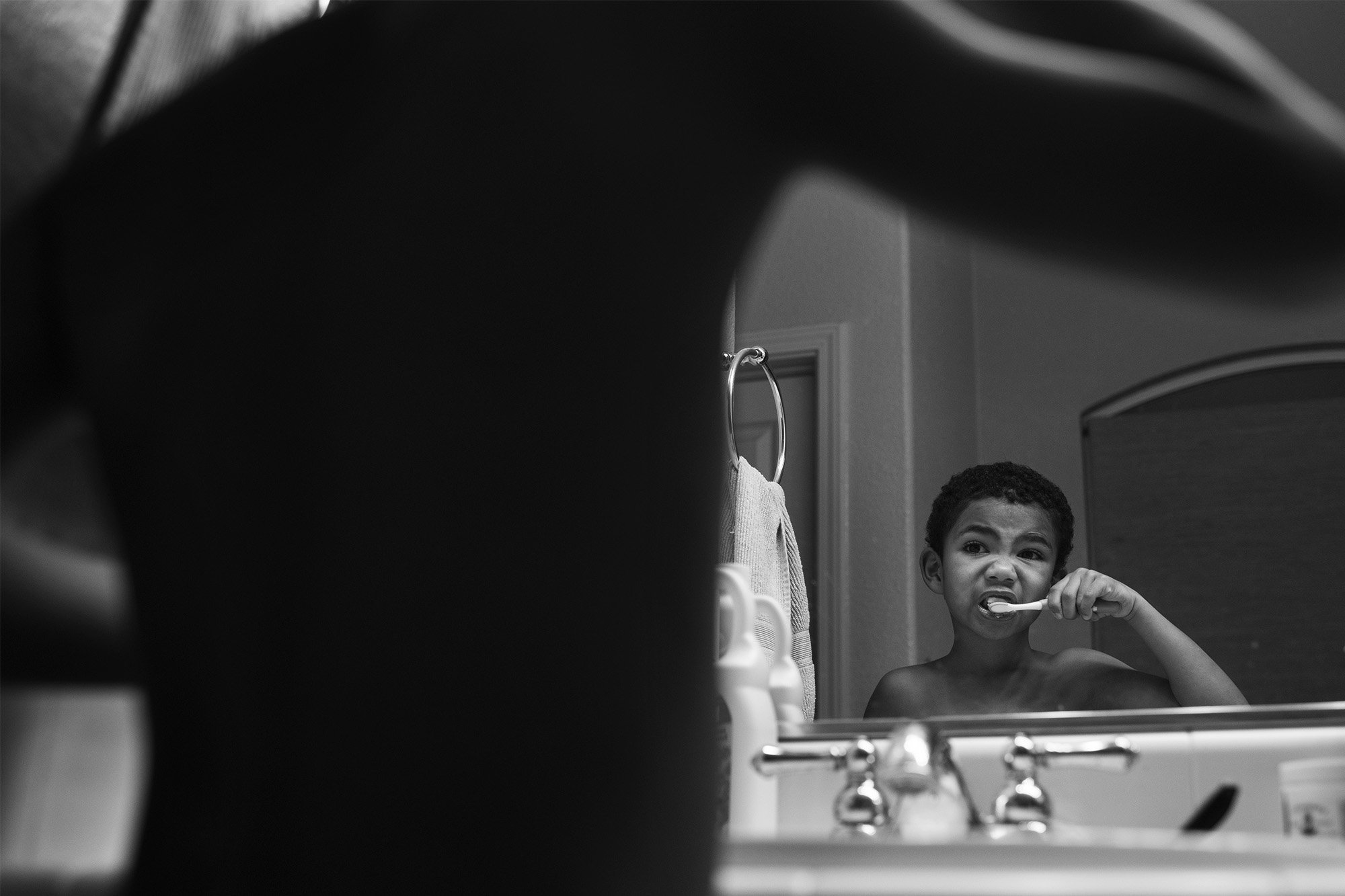 boy brushes teeth - documentary family photography