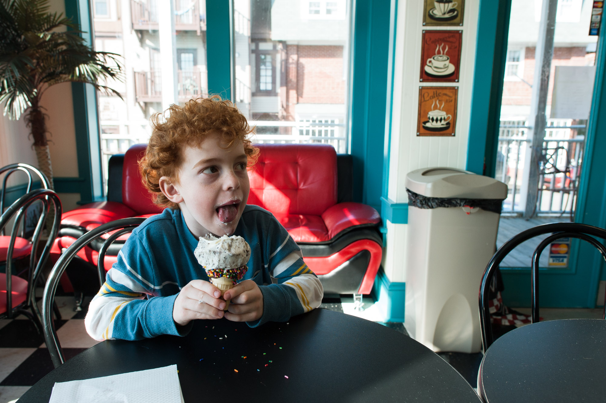 boy eats ice cream cone - documentary family photography