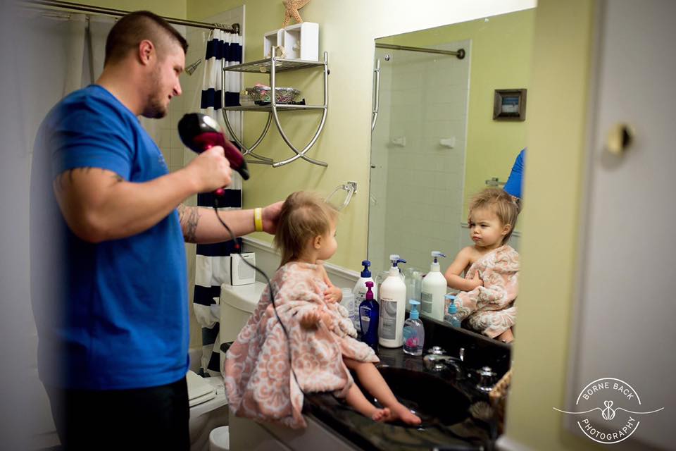 father dries daughters hair - documentary family photography