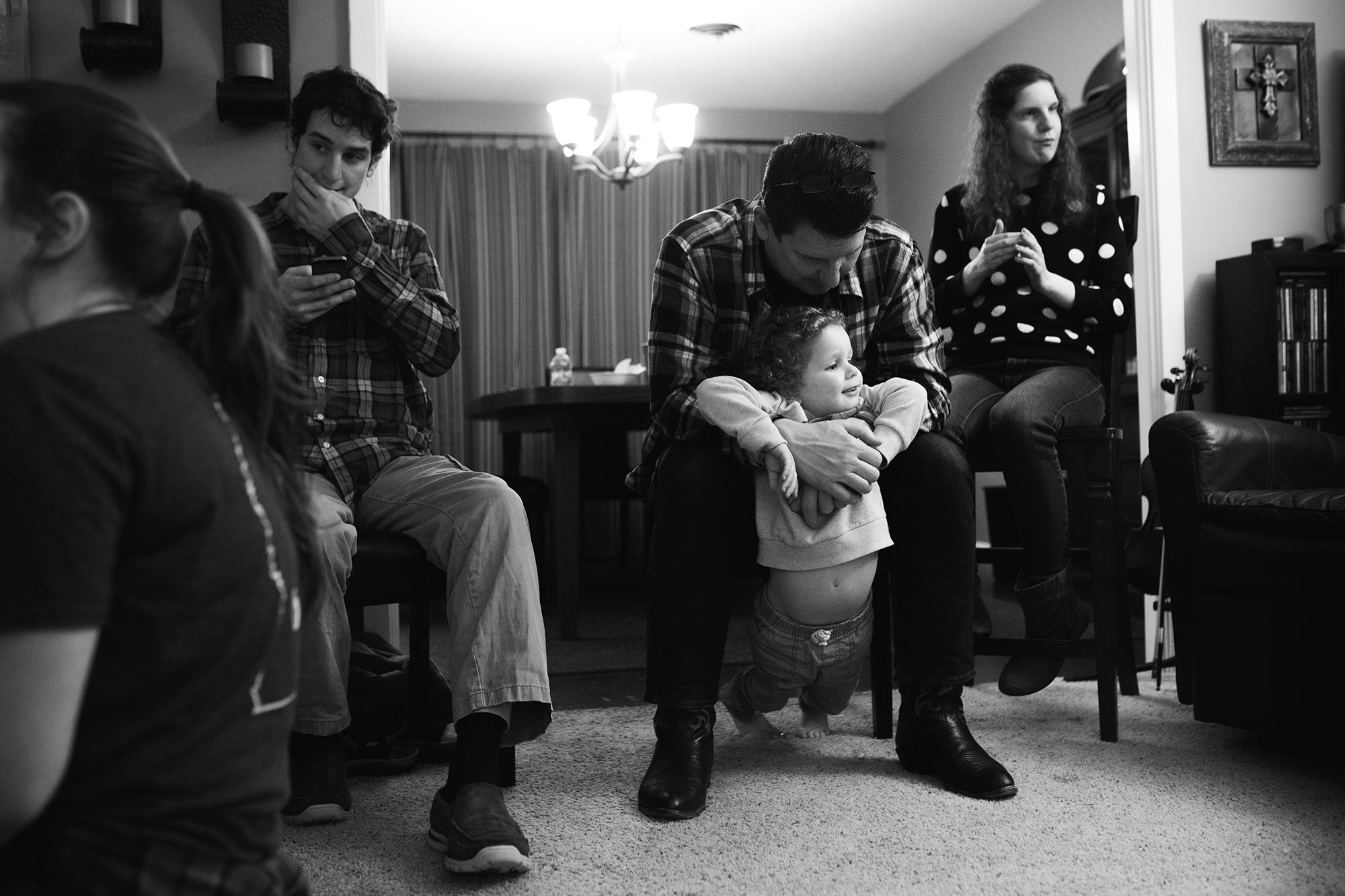 father holds young boy - documentary family photography