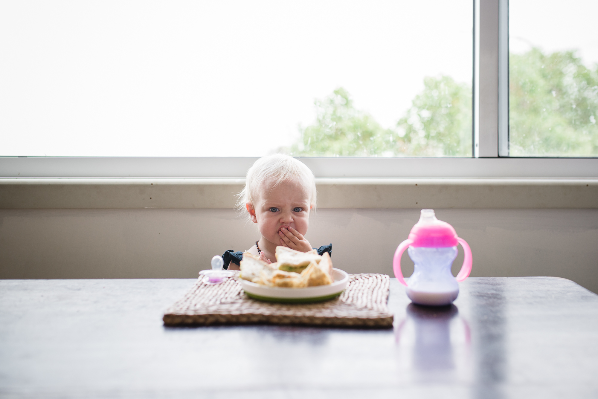 little girl burp face - documentary family photography