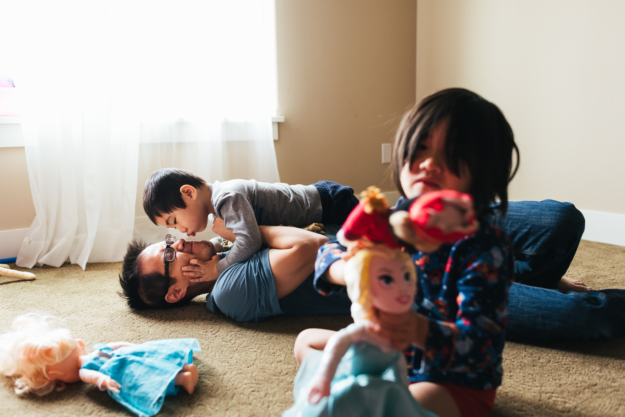 boy kisses father - documentary family photography