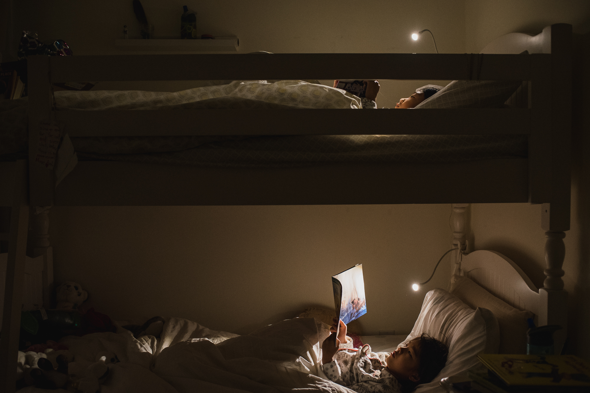 girls read in bunk beds - documentary family photography