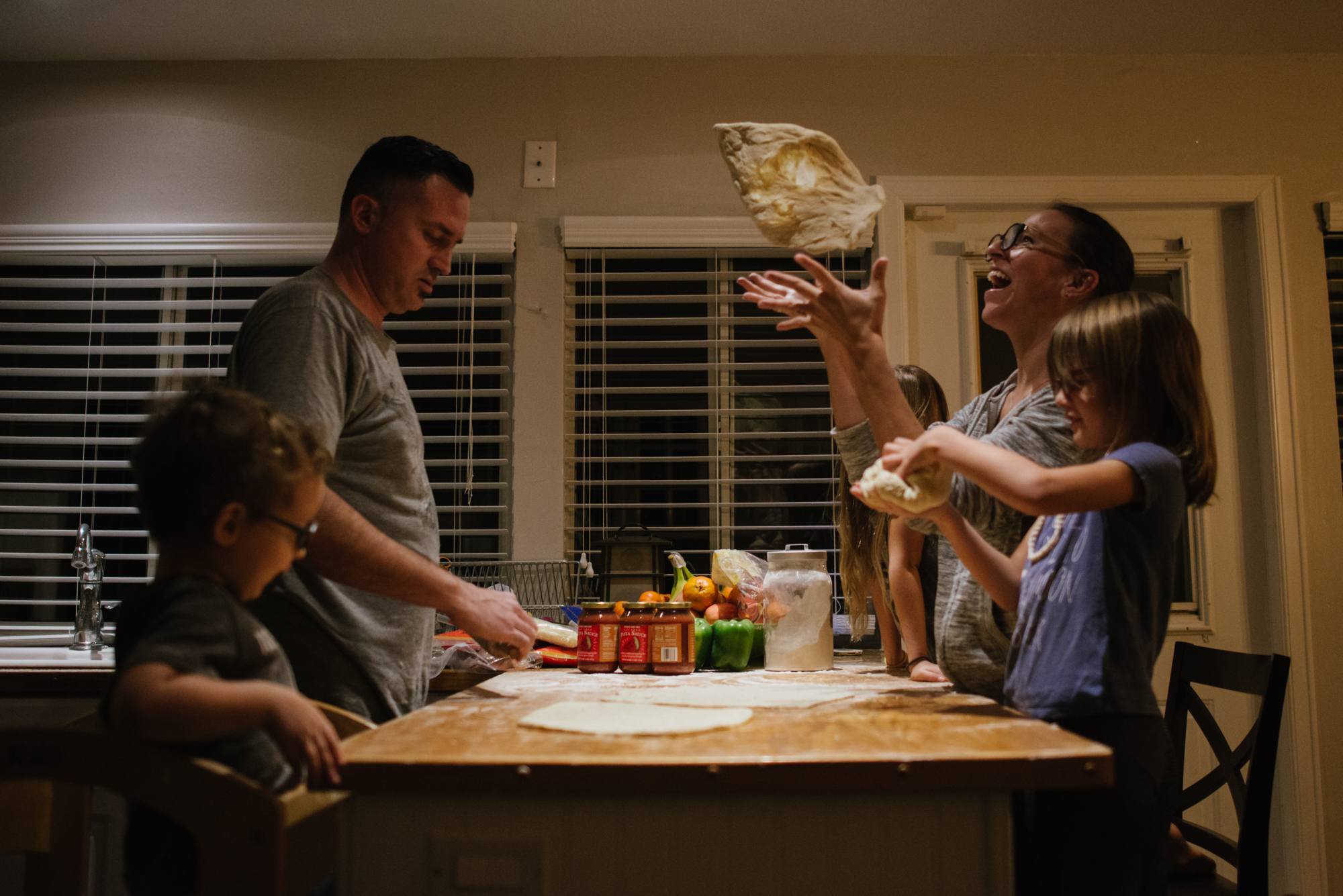 family makes pizza together -documentary family photography
