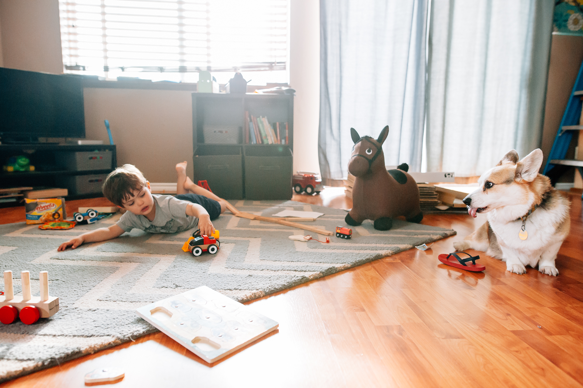 boy plays in empty living room