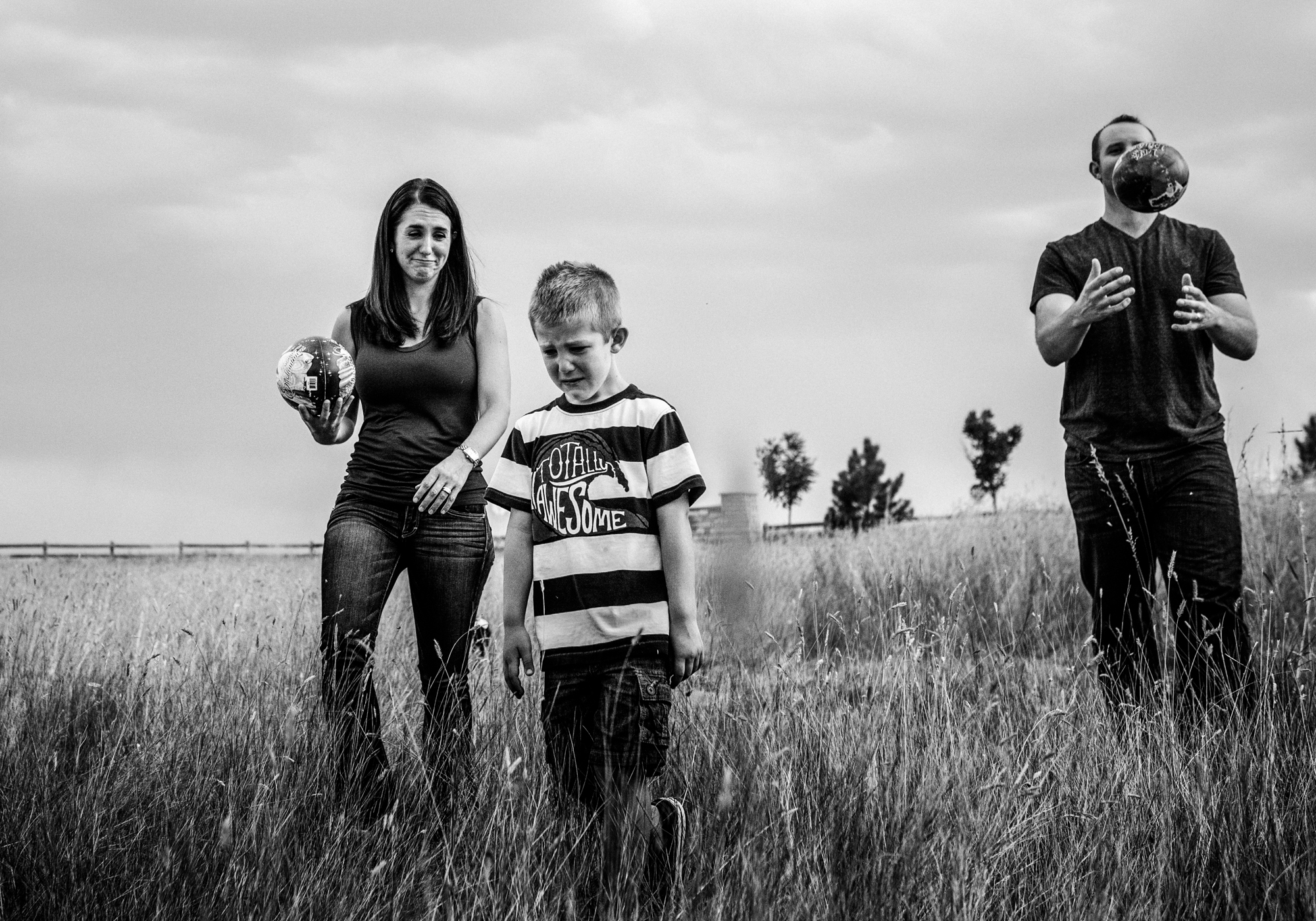 Mom empathizing with her son feeling sad while dad is oblivious 