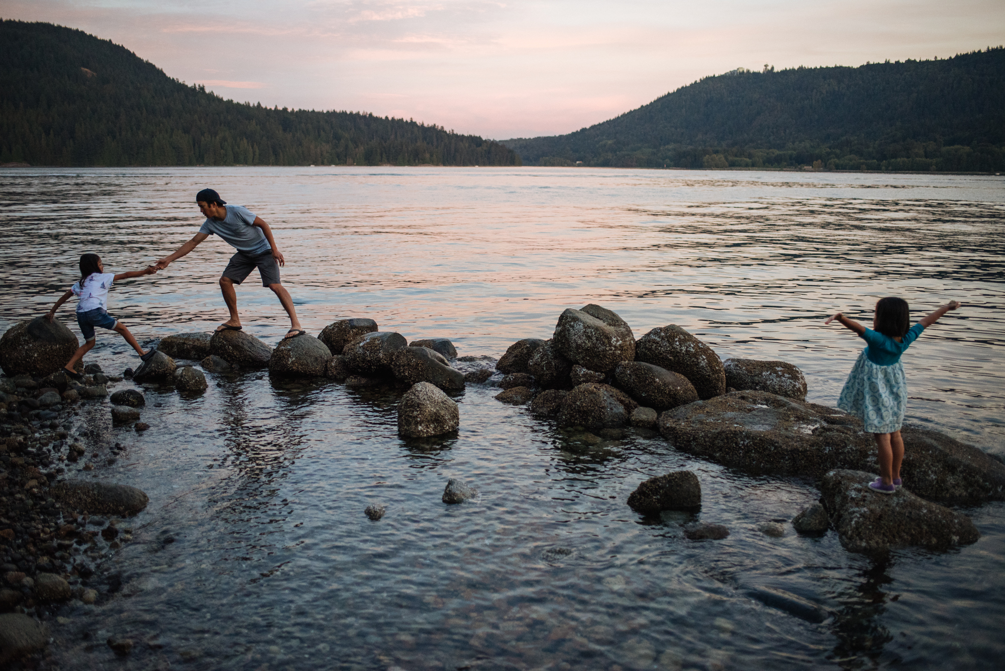 A family Boulder hopping in the ocean 