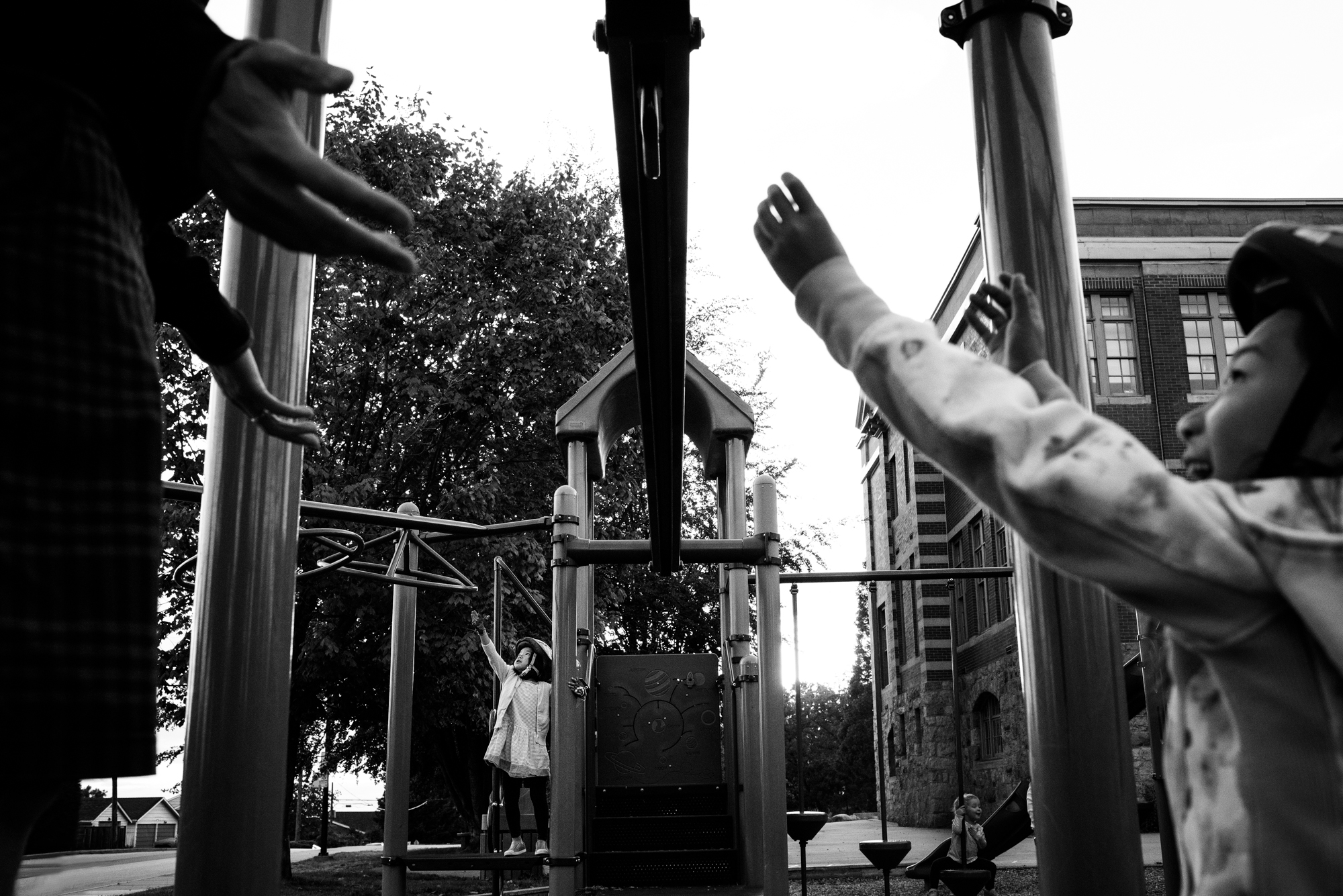 little kids reaching out for help at the playground