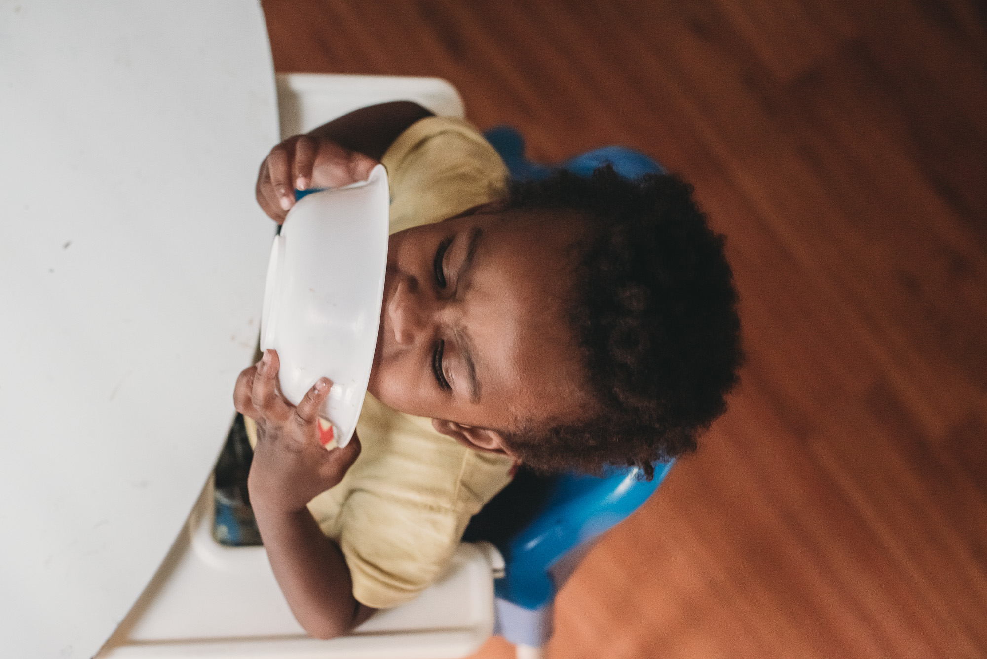 boy licks bowl - Documentary Family Photography