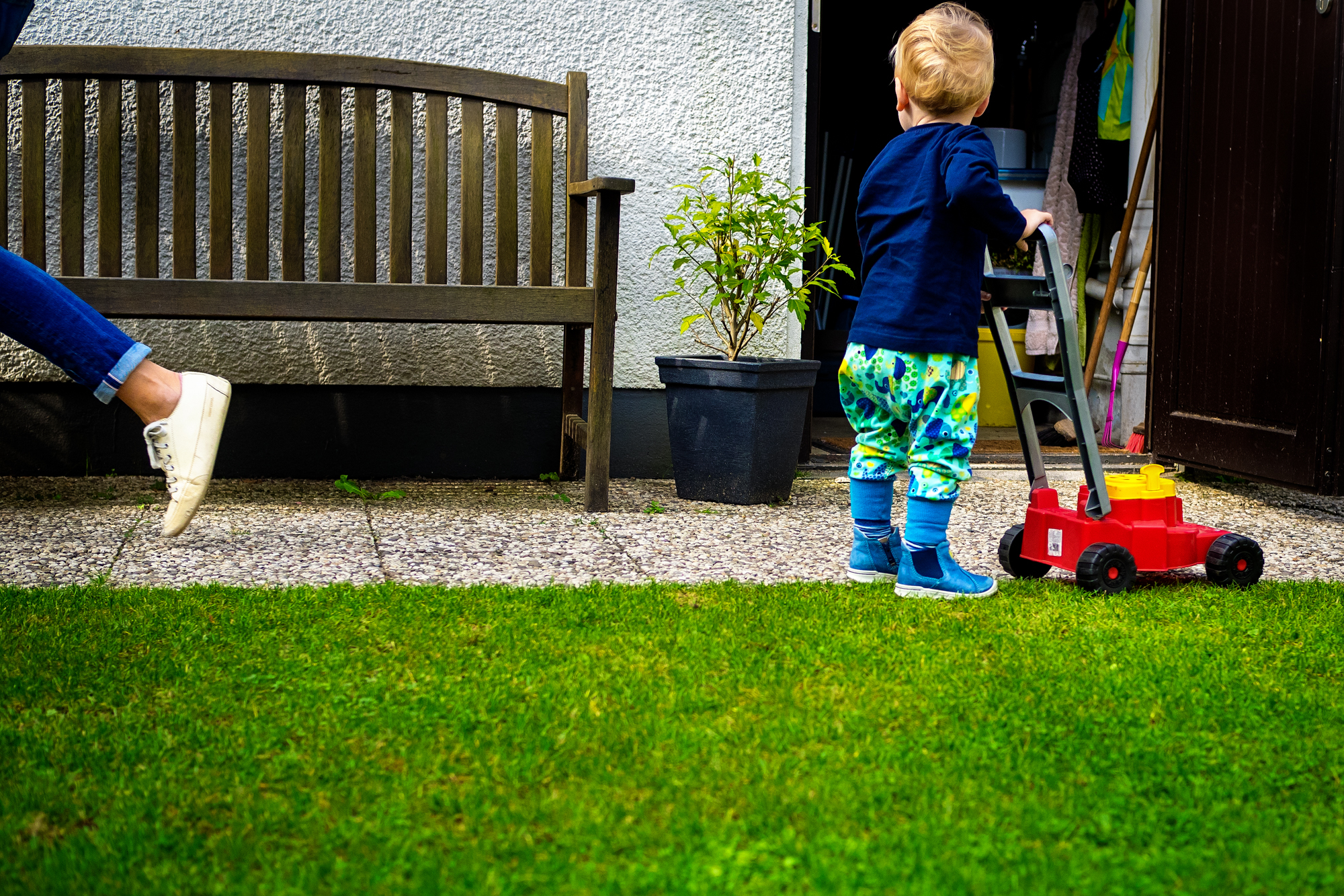 kid with toy lawnmower - Documentary Family Photography