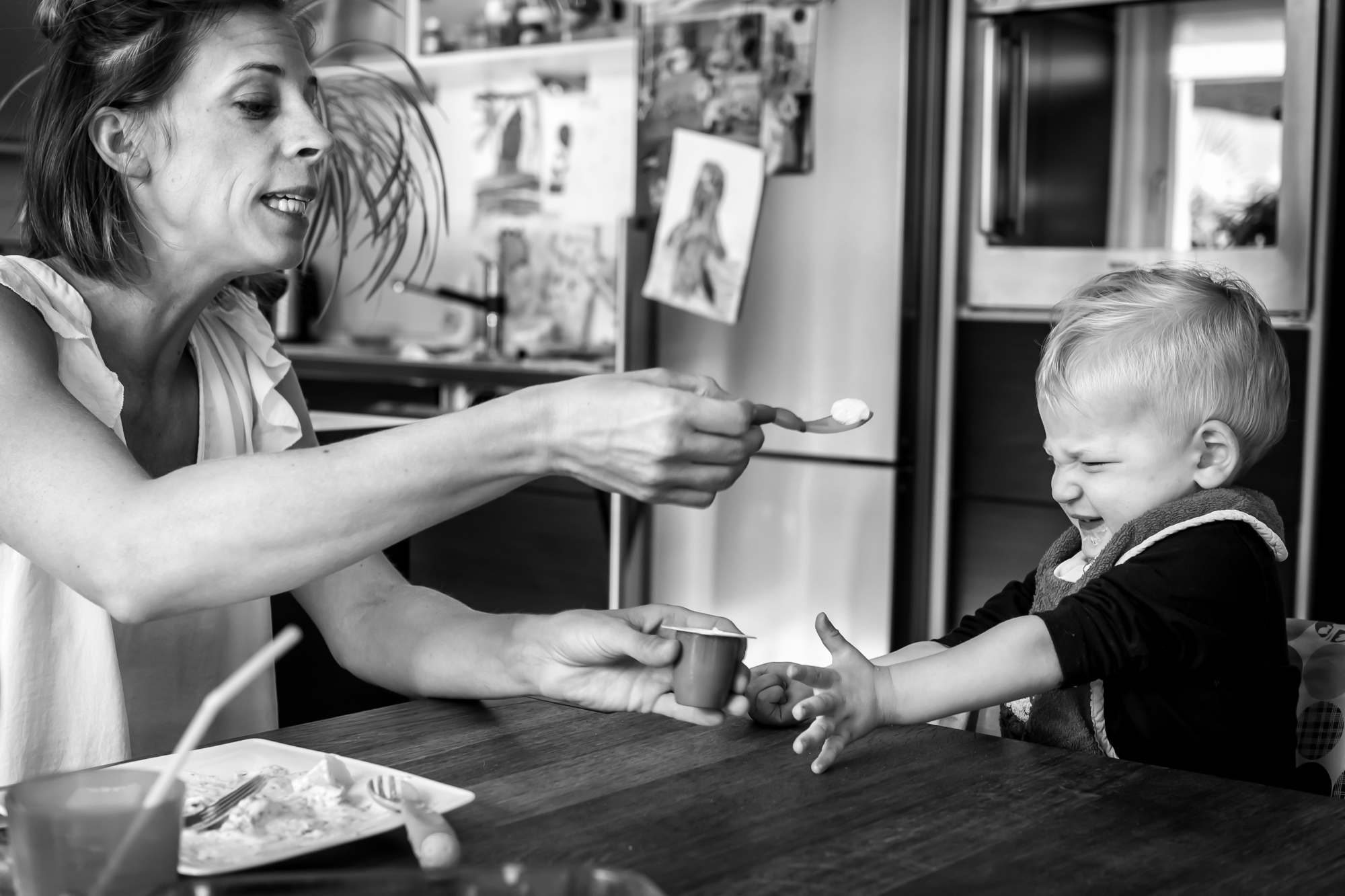 mother struggles to feed baby - Documentary Family Photography