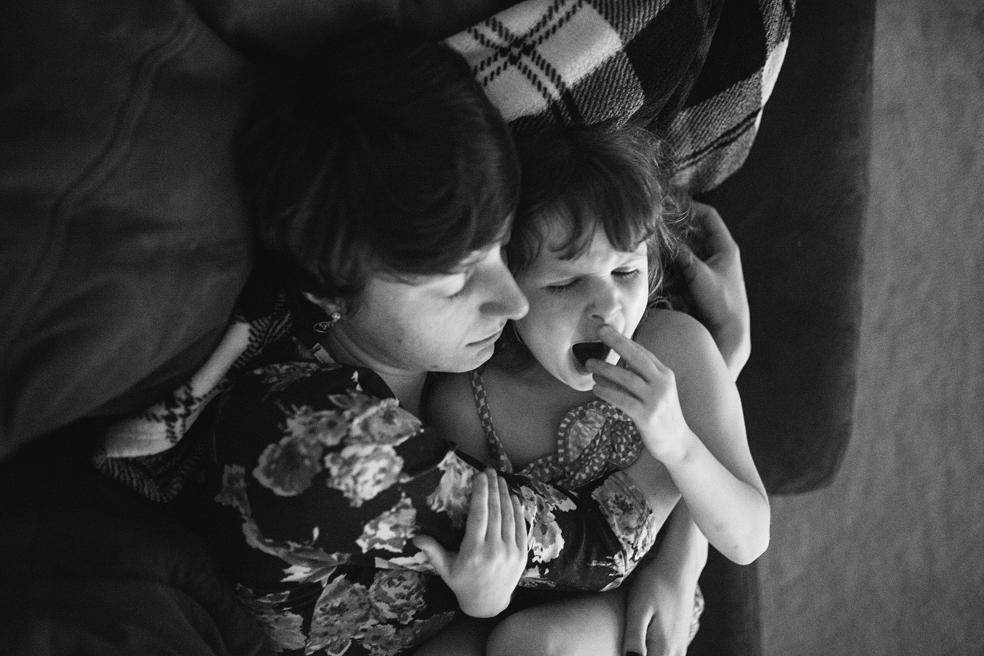 individual snuggling young child - Documentary Family Photography