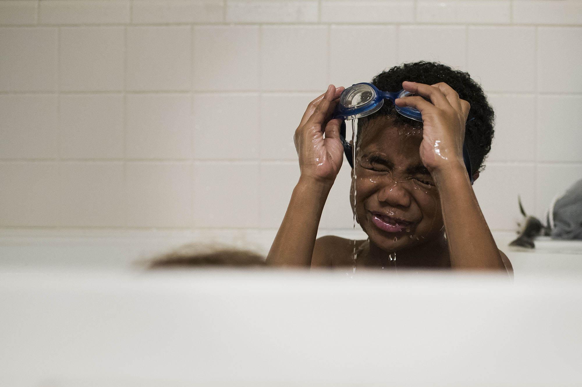 boy with goggles in tub - Documentary Family Photography