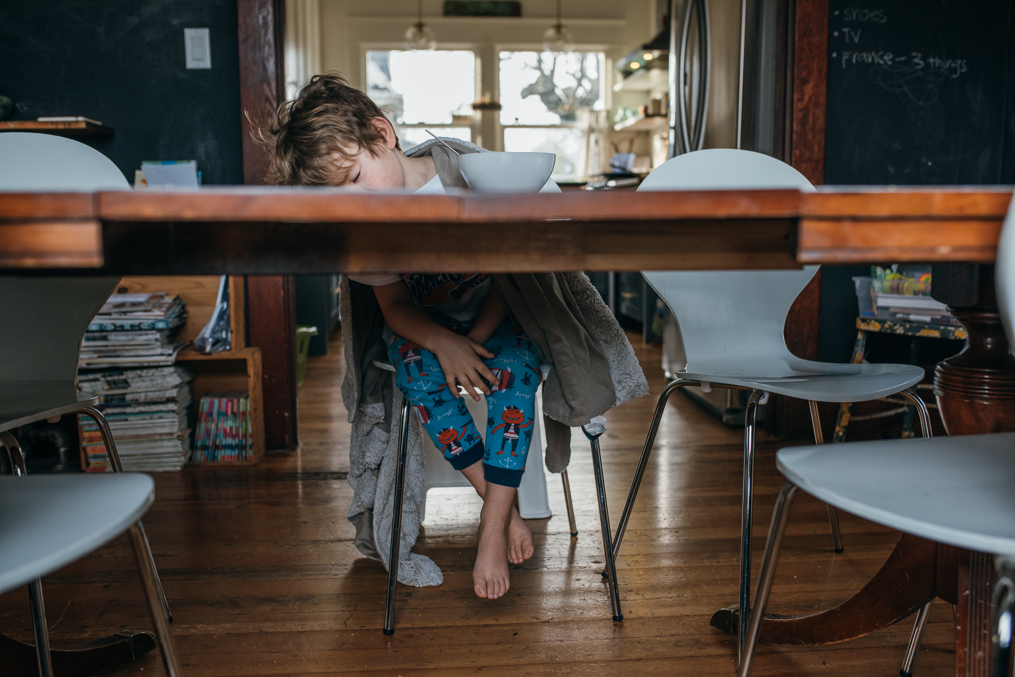 boy asleep a breakfast table - Documentary Family Photography