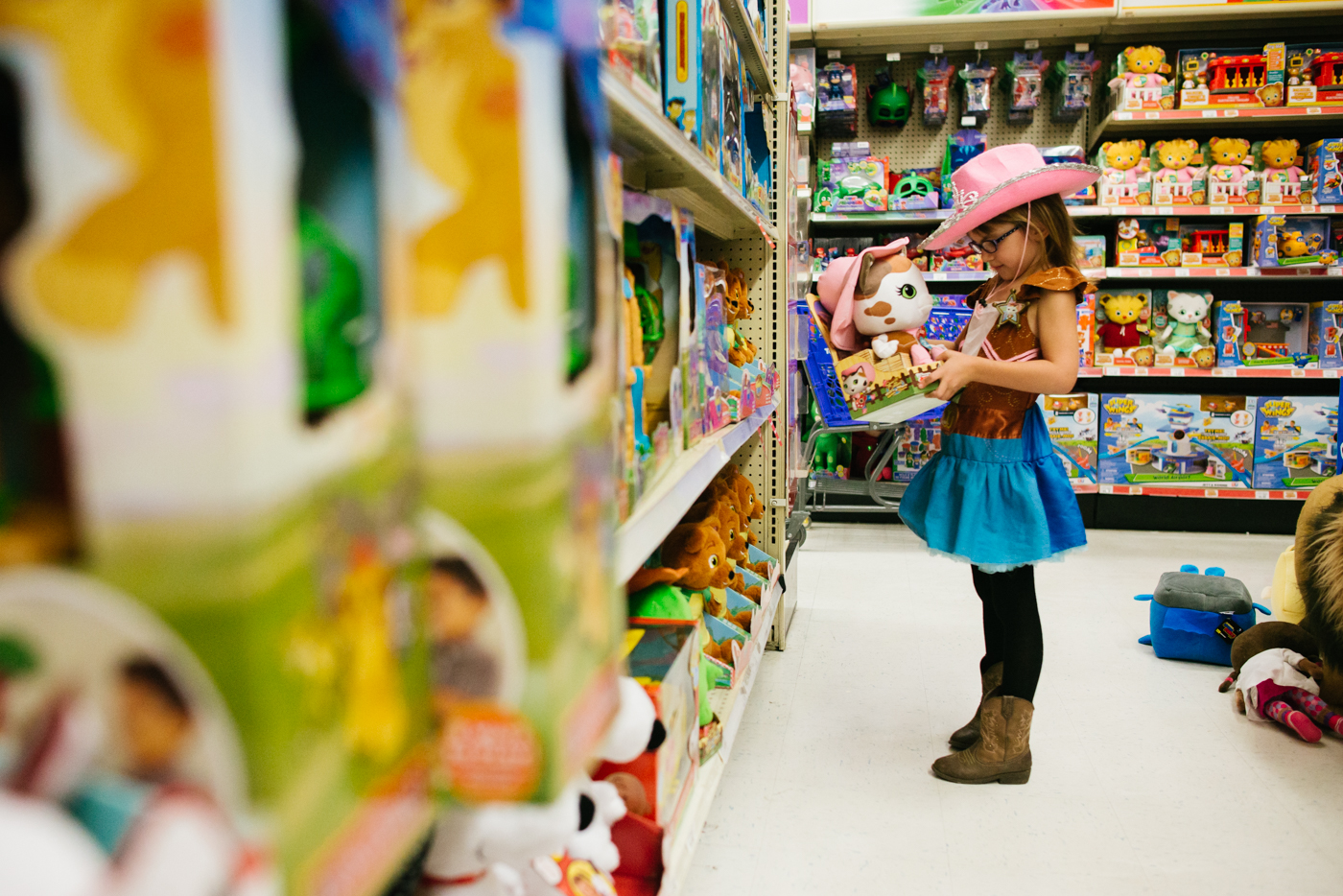 girl with cowboy hat at store -Documentary Family Photography