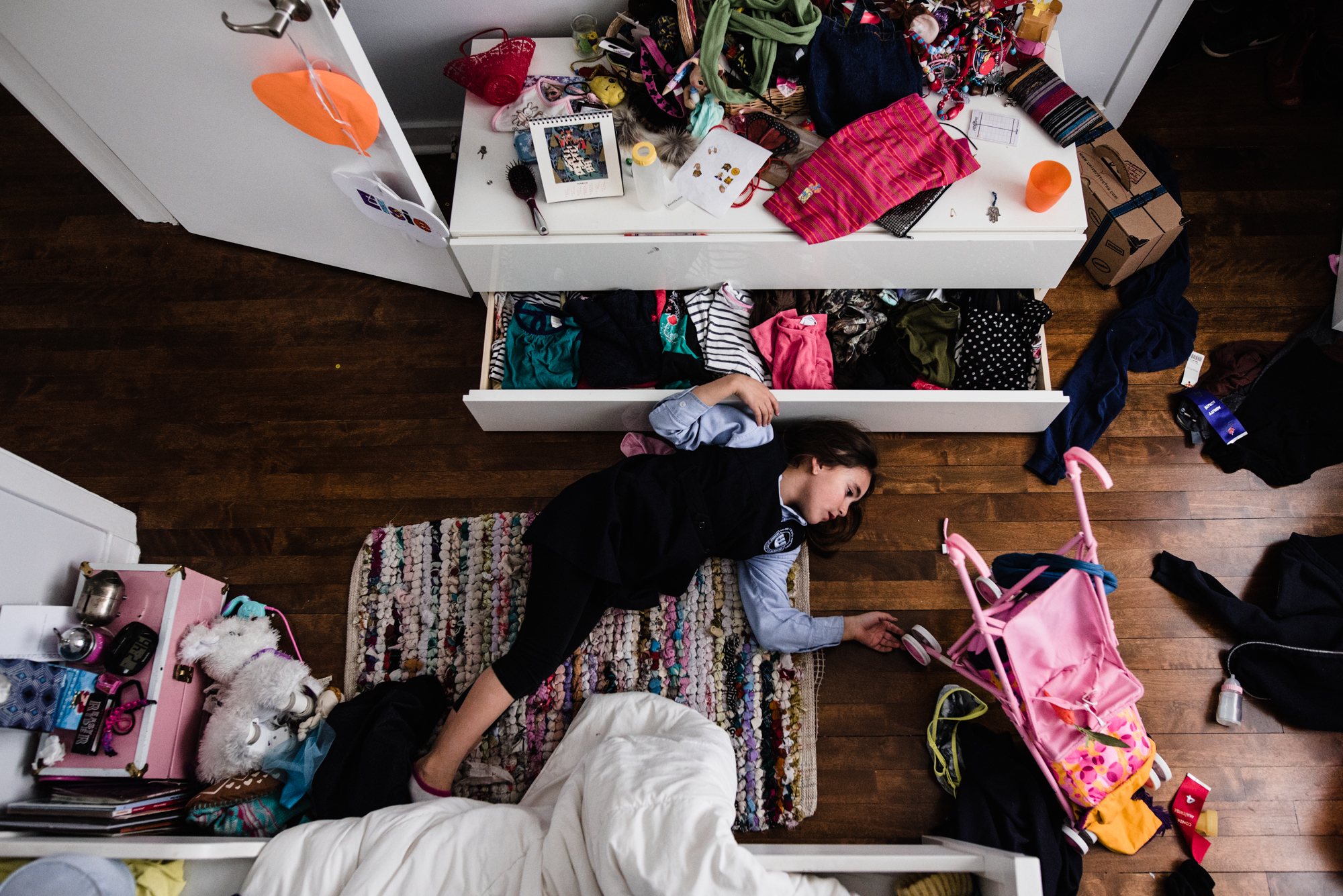 girl sprawled on bedroom floor - Documentary Family Photography