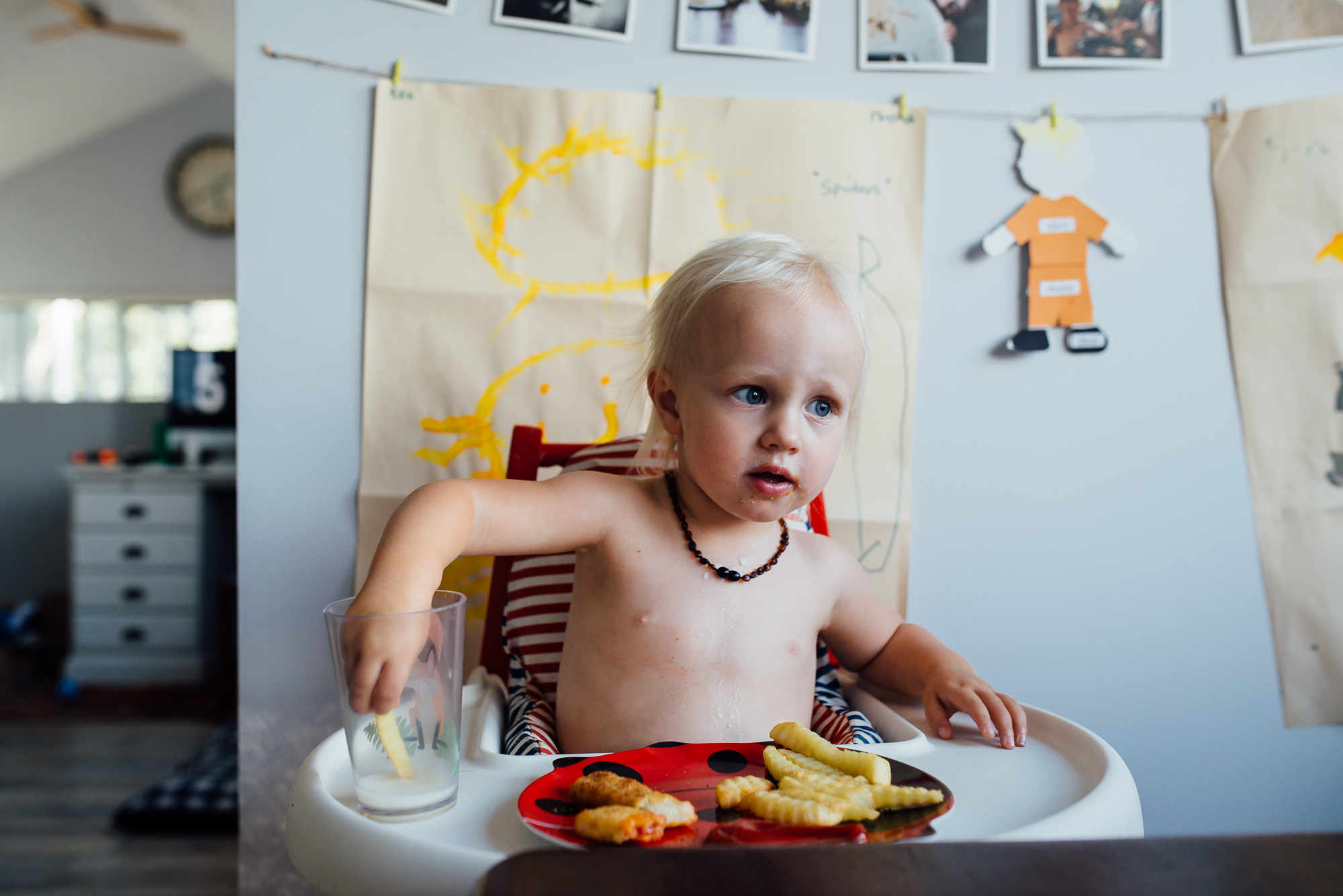 child dips french fried in milk - Documentary Family Photography