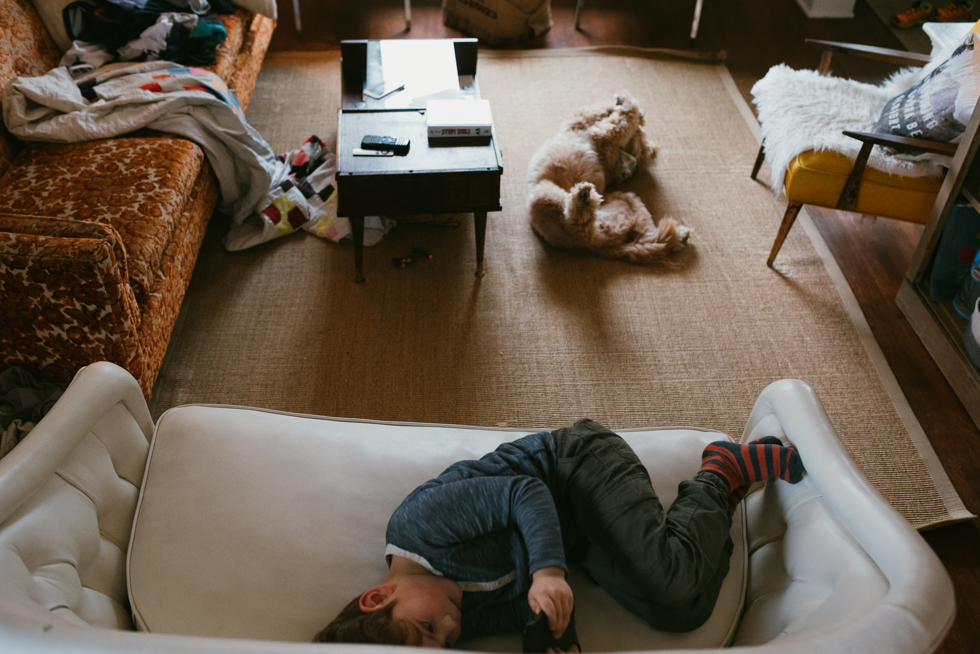 child and dog lounging - Documentary Family Photography