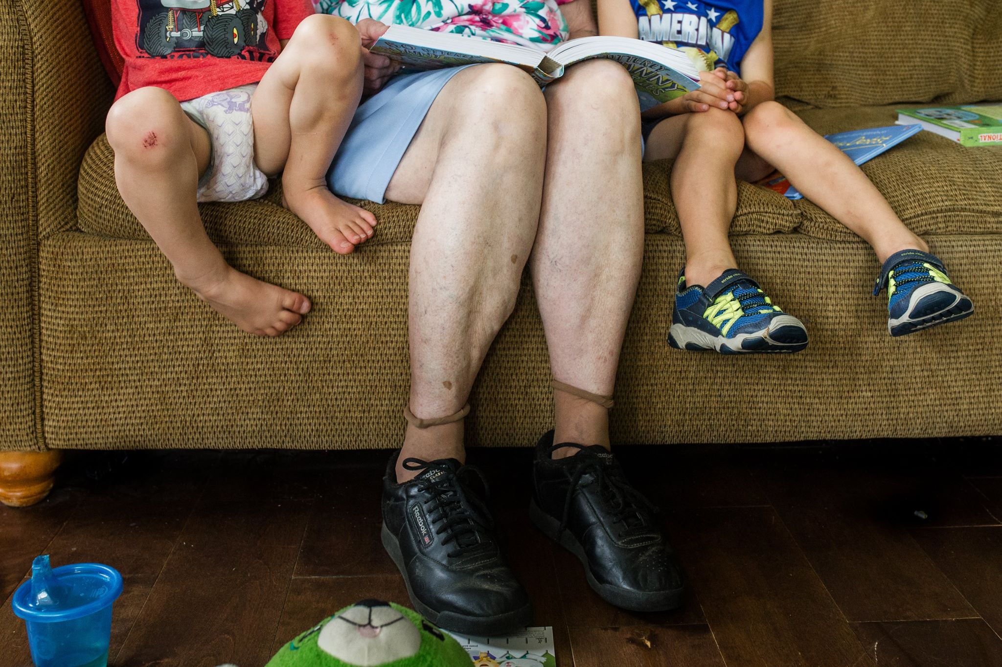 kids reading with grandparent - documentary family photography