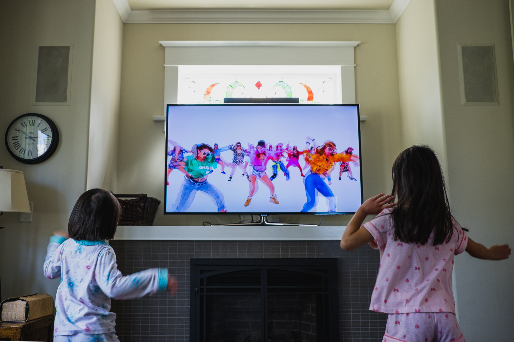 children watch dancers on TV - Documentary Family Photography