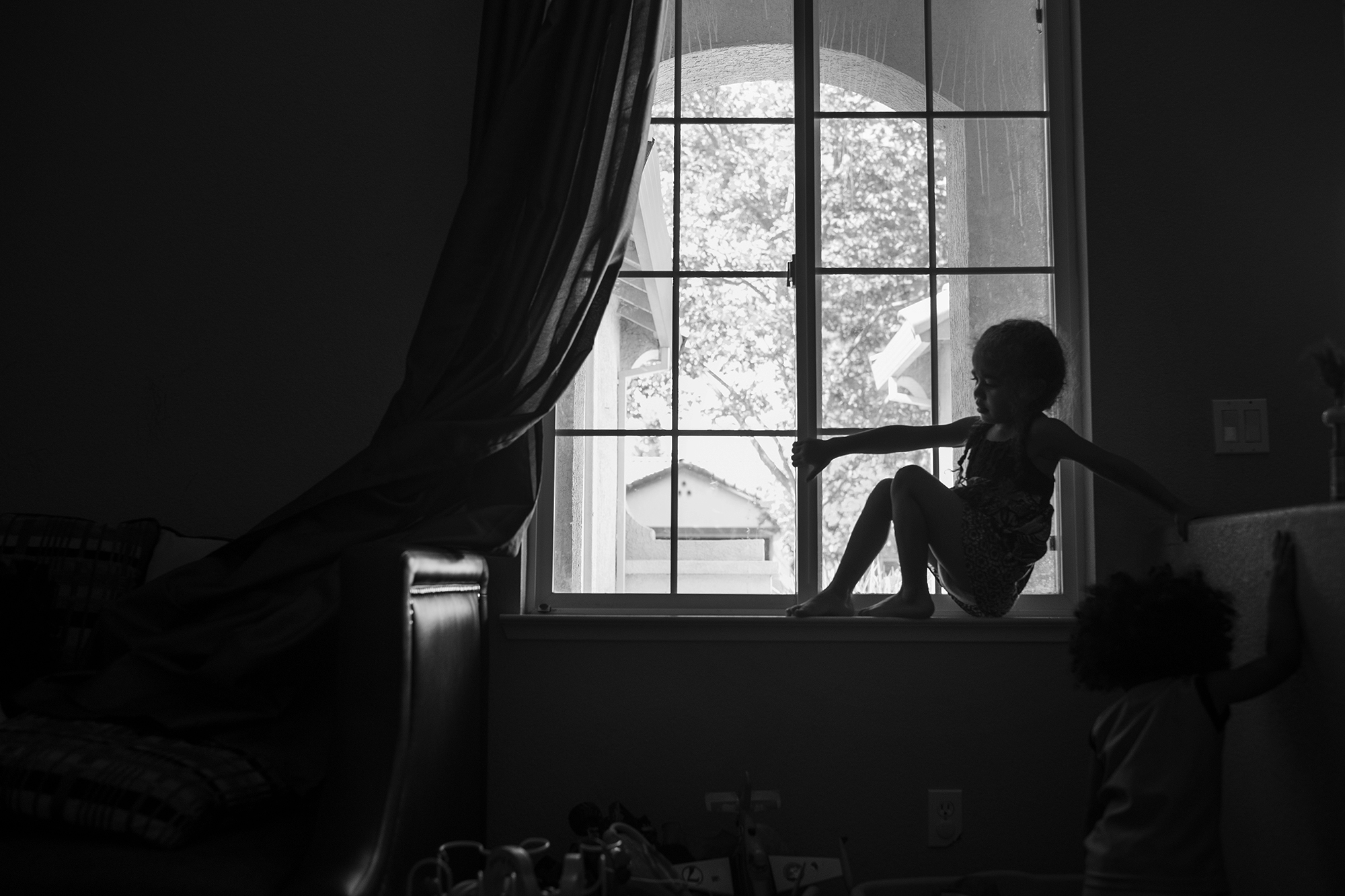 child in window - Documentary Family Photography