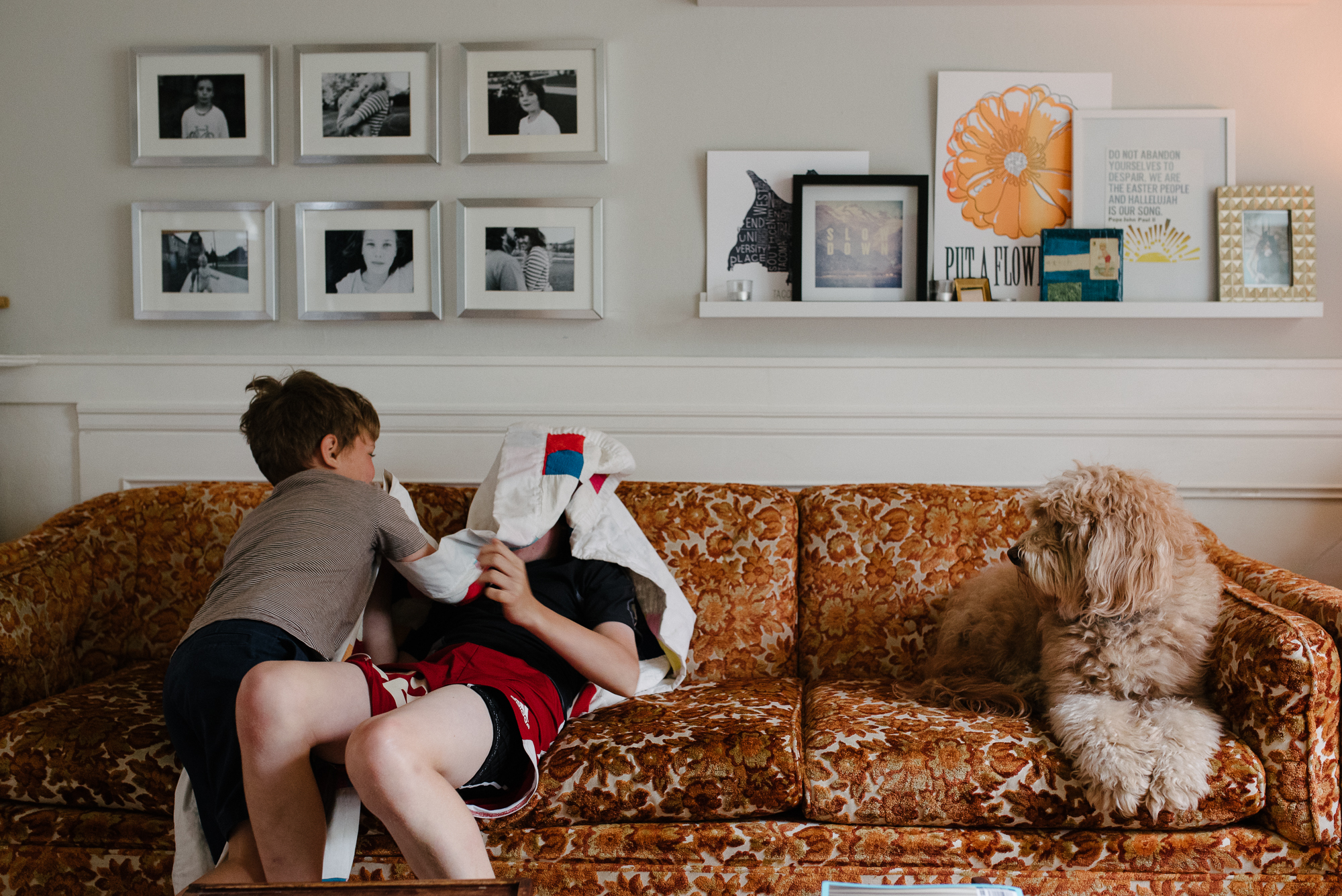 kids wrestle on couch - Documentary Family Photography