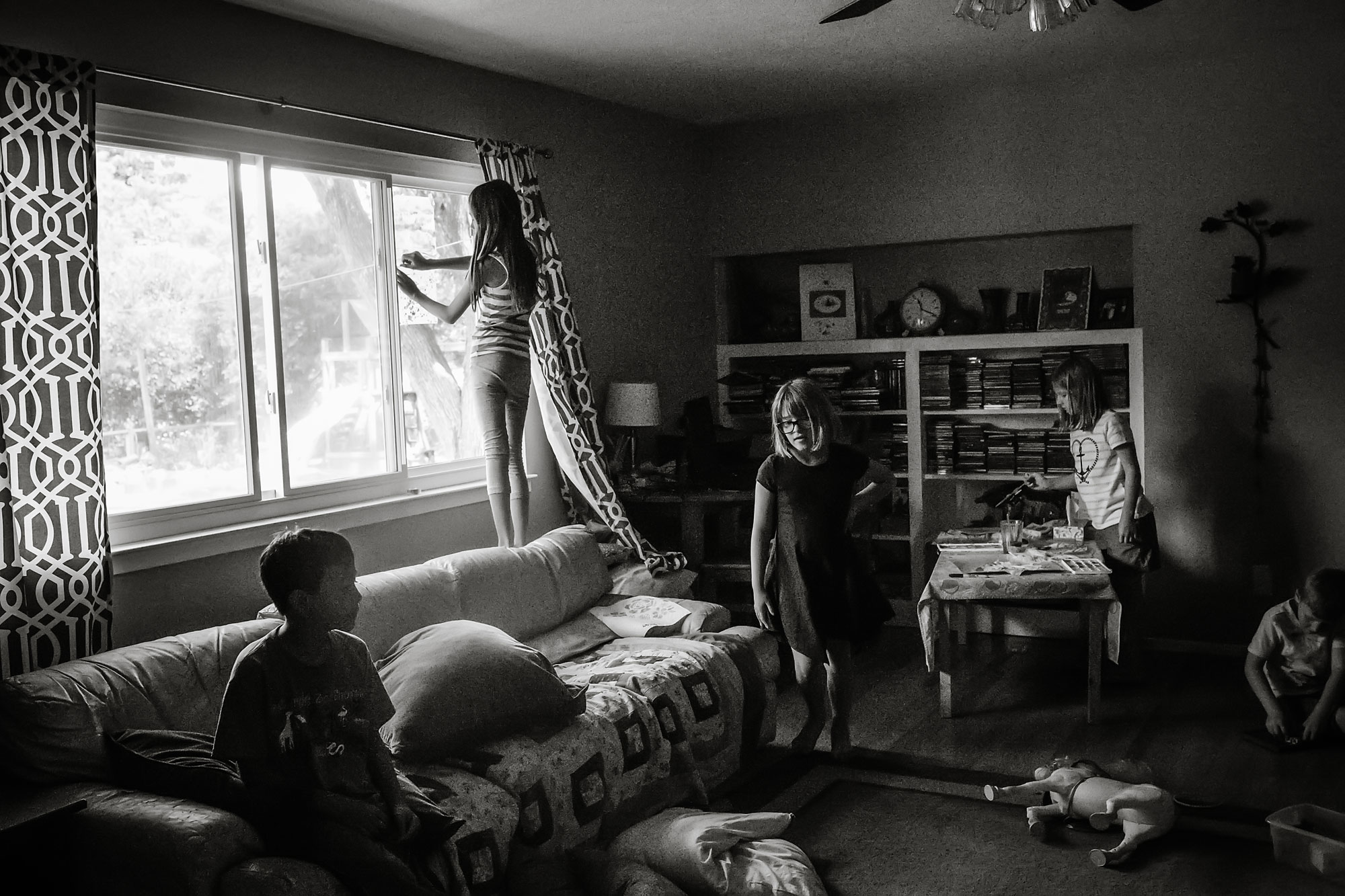 girl at window - documentary family photography