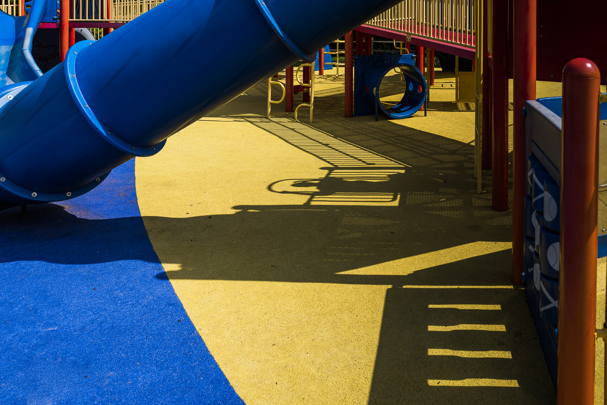 shadow of child on playground - Documentary family photography