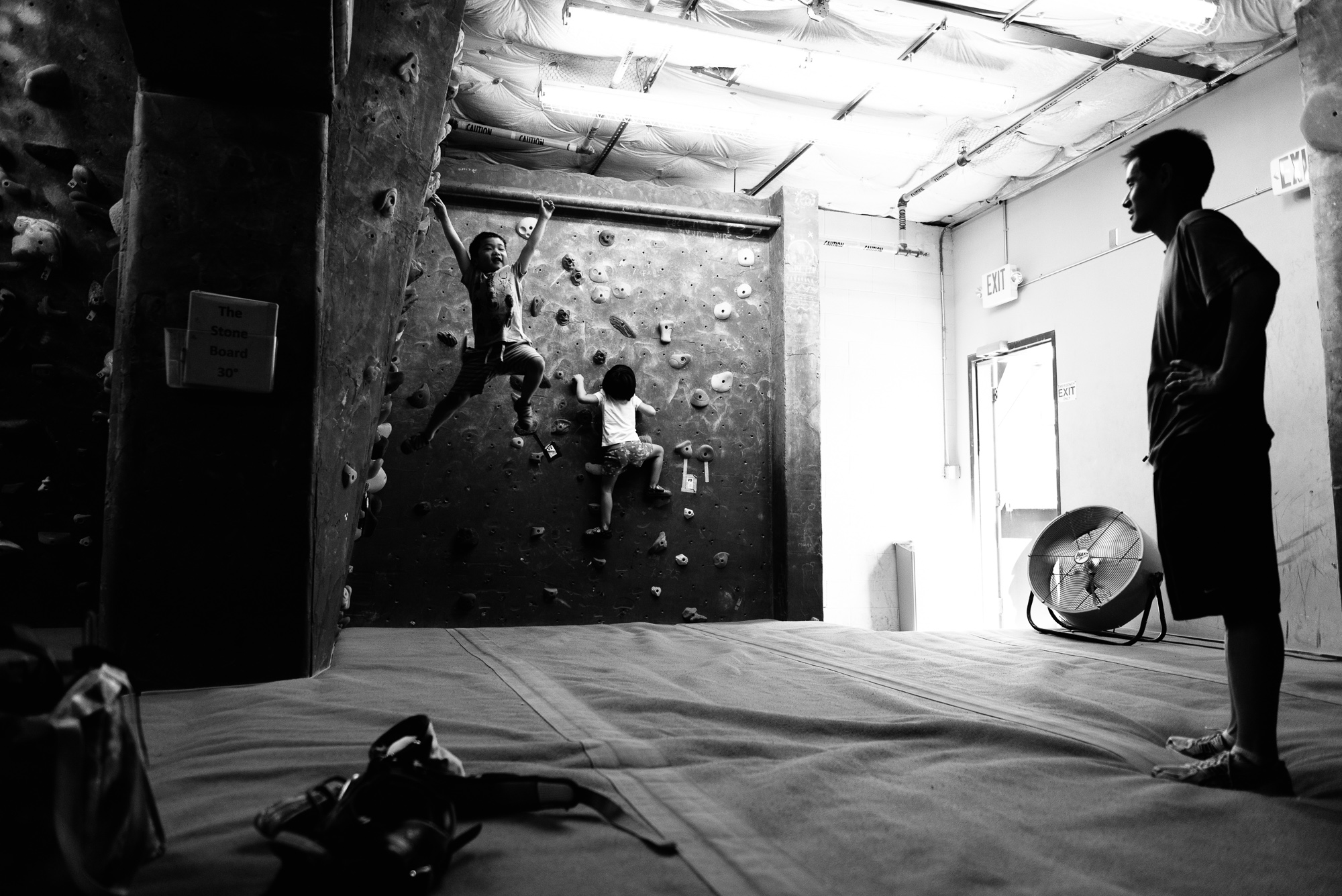 kids on climbing wall - Documentary family photography