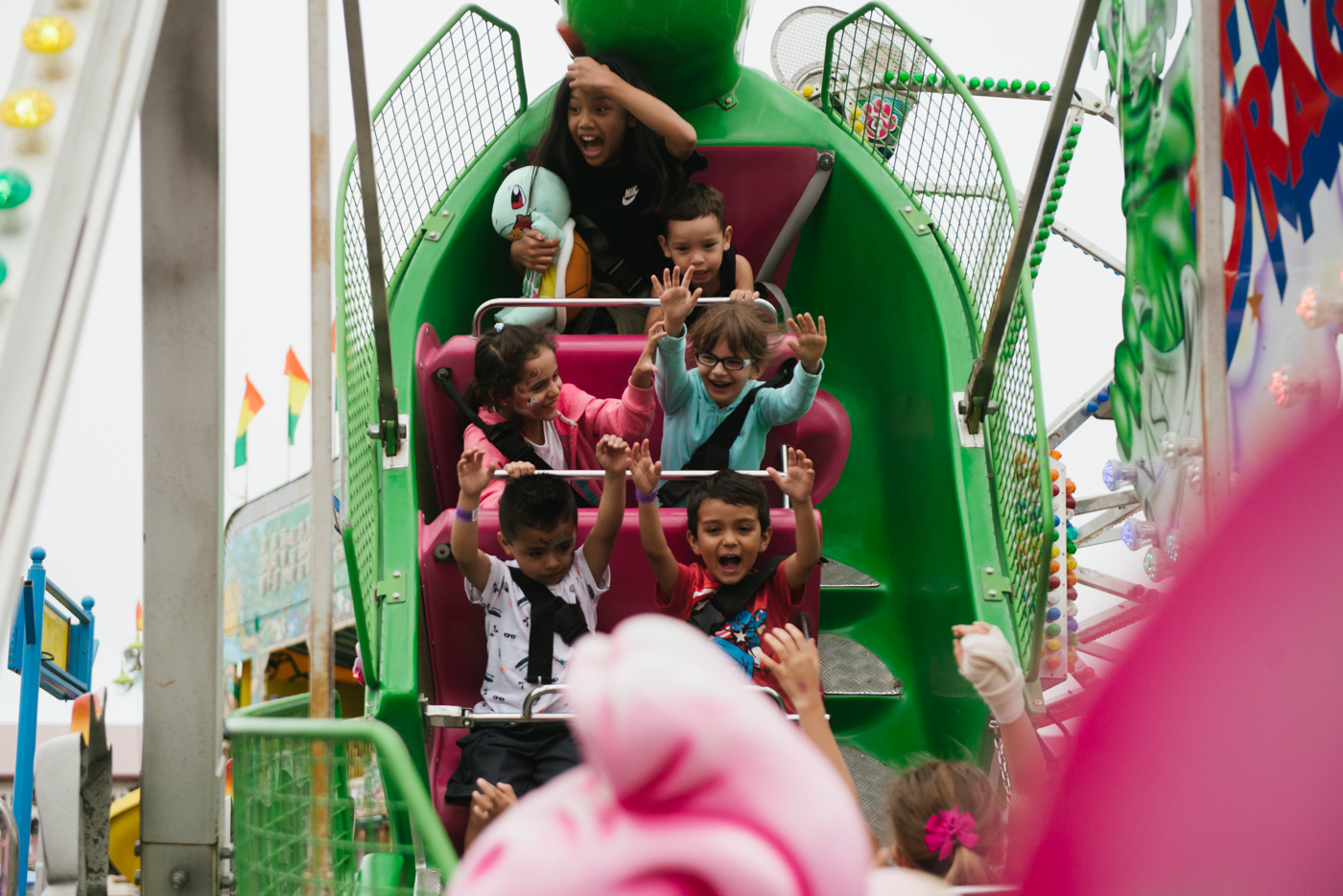 kids on amusement park ride - Documentary family photography