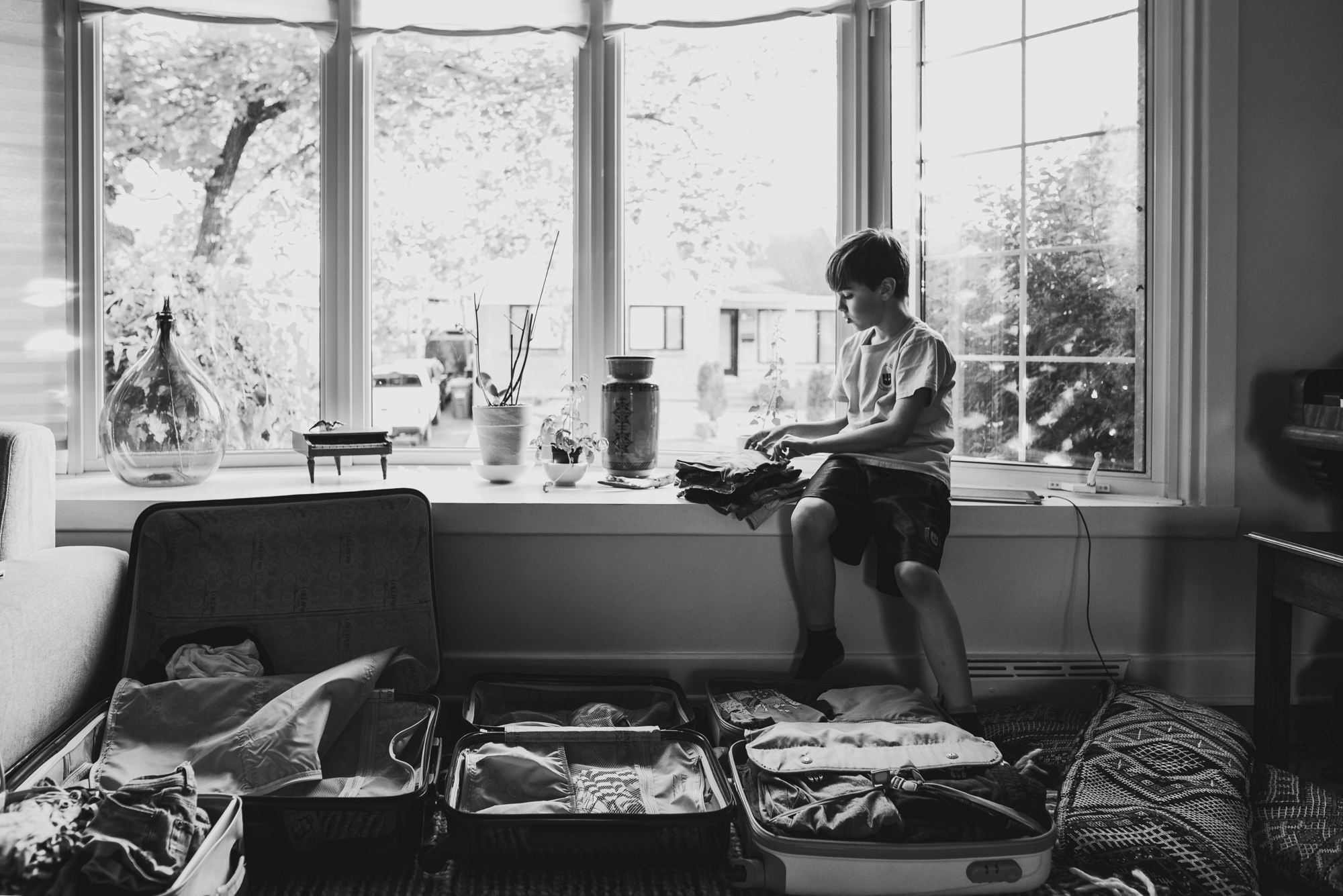 boy in window - Documentary Family Photography