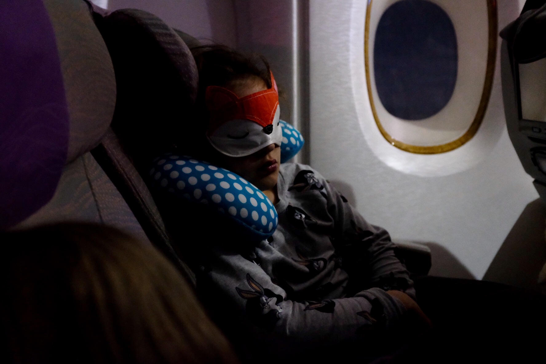 child asleep on plane - Documentary Family Photography