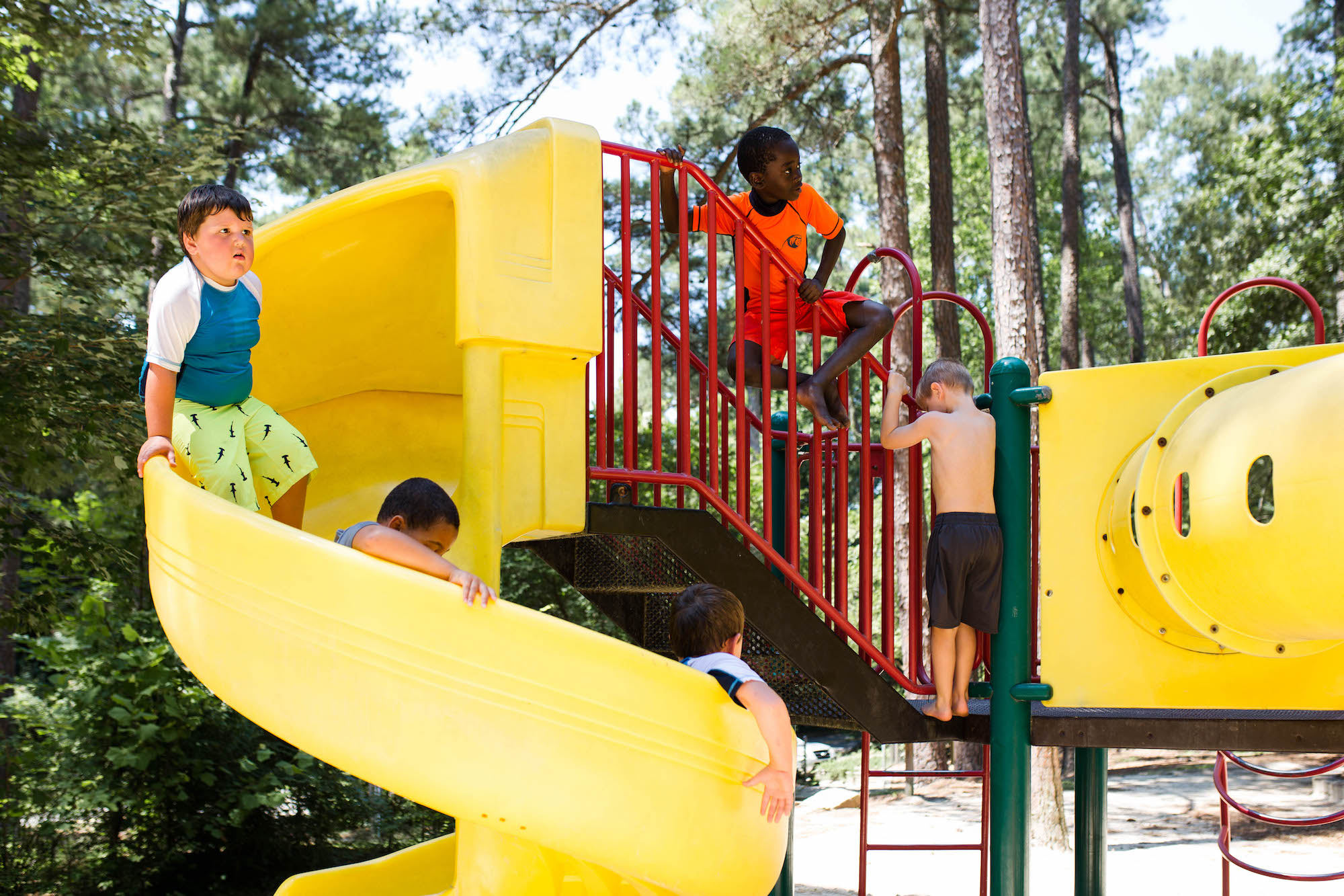 kids on twisty slide -Documentary Family Photography