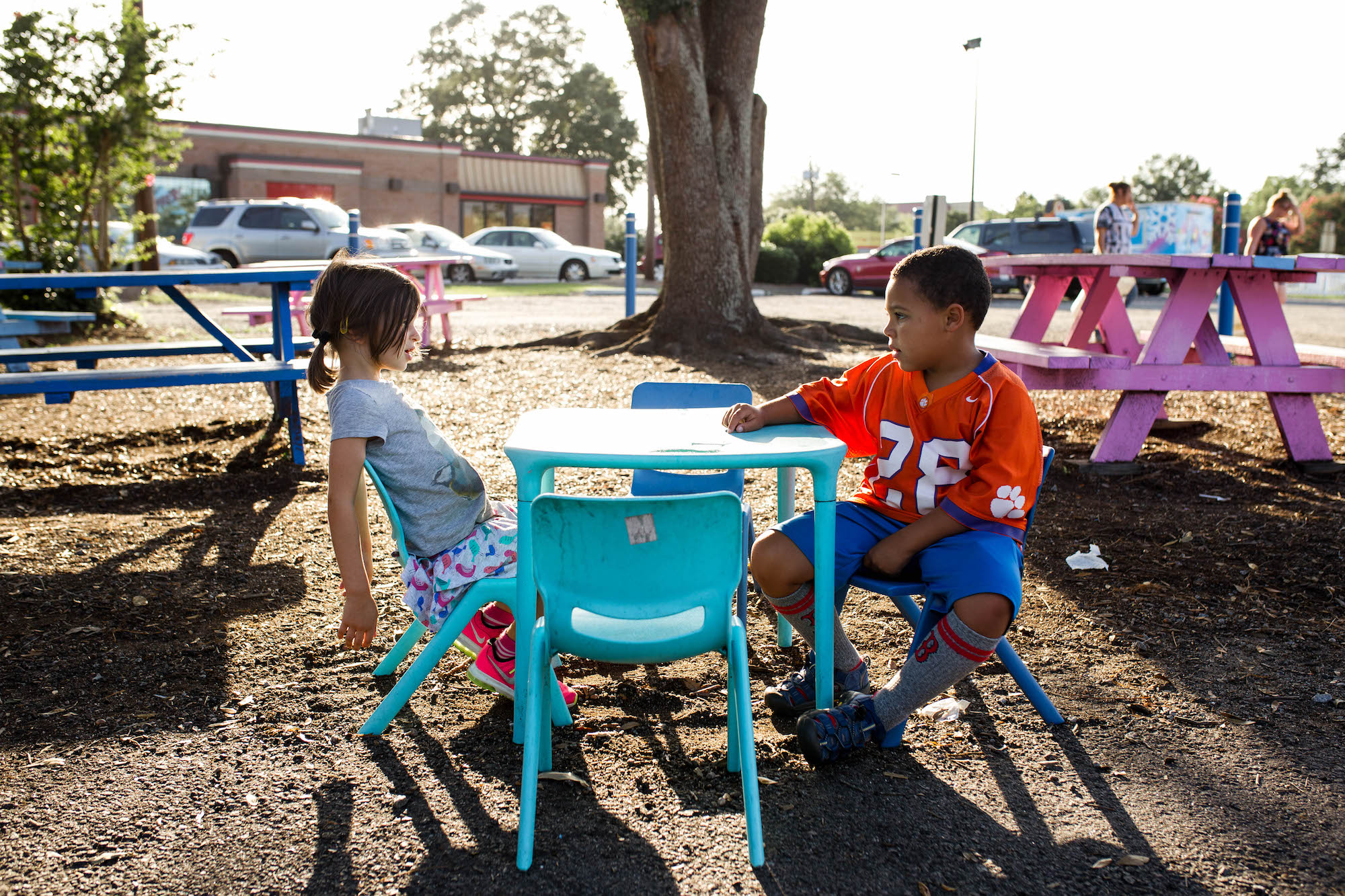 kids chat at picnic table - Documentary Family Photography