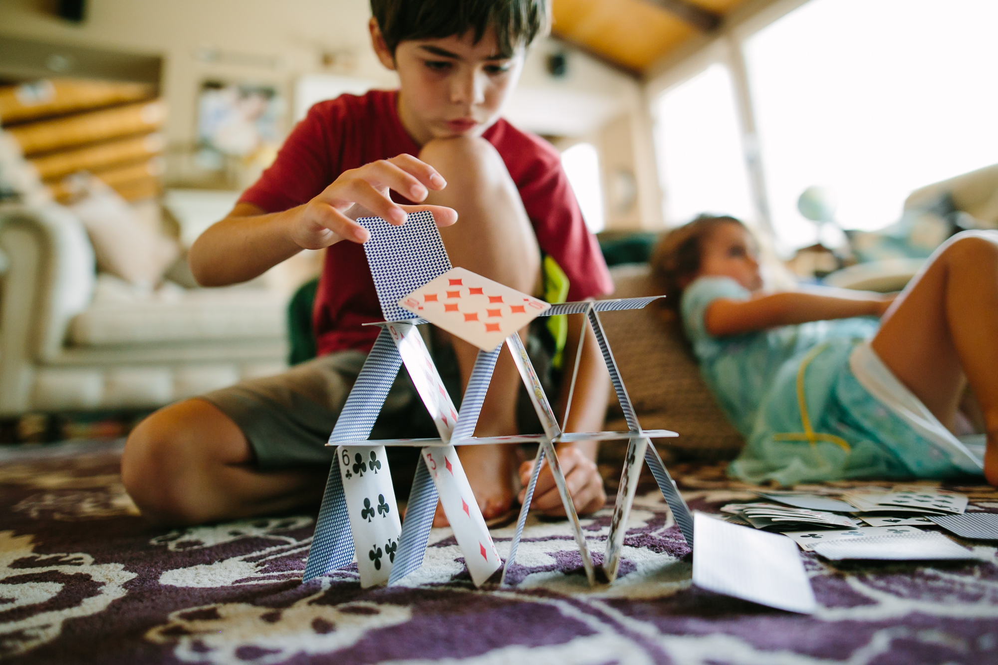 kid builds house of cards - Documentary Family Photography