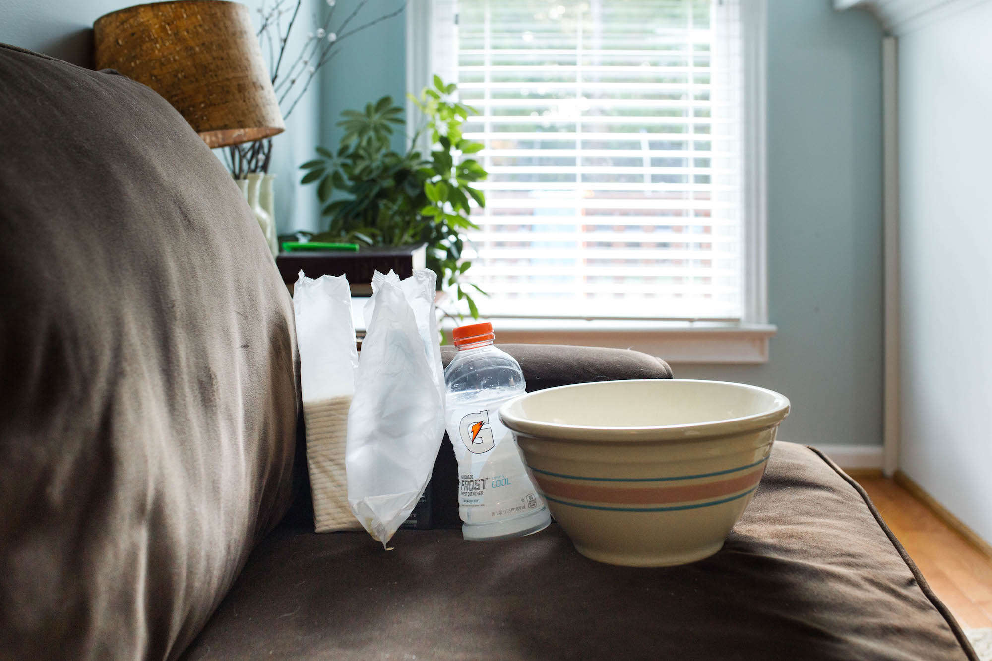 dishes left on couch - documentary family photography