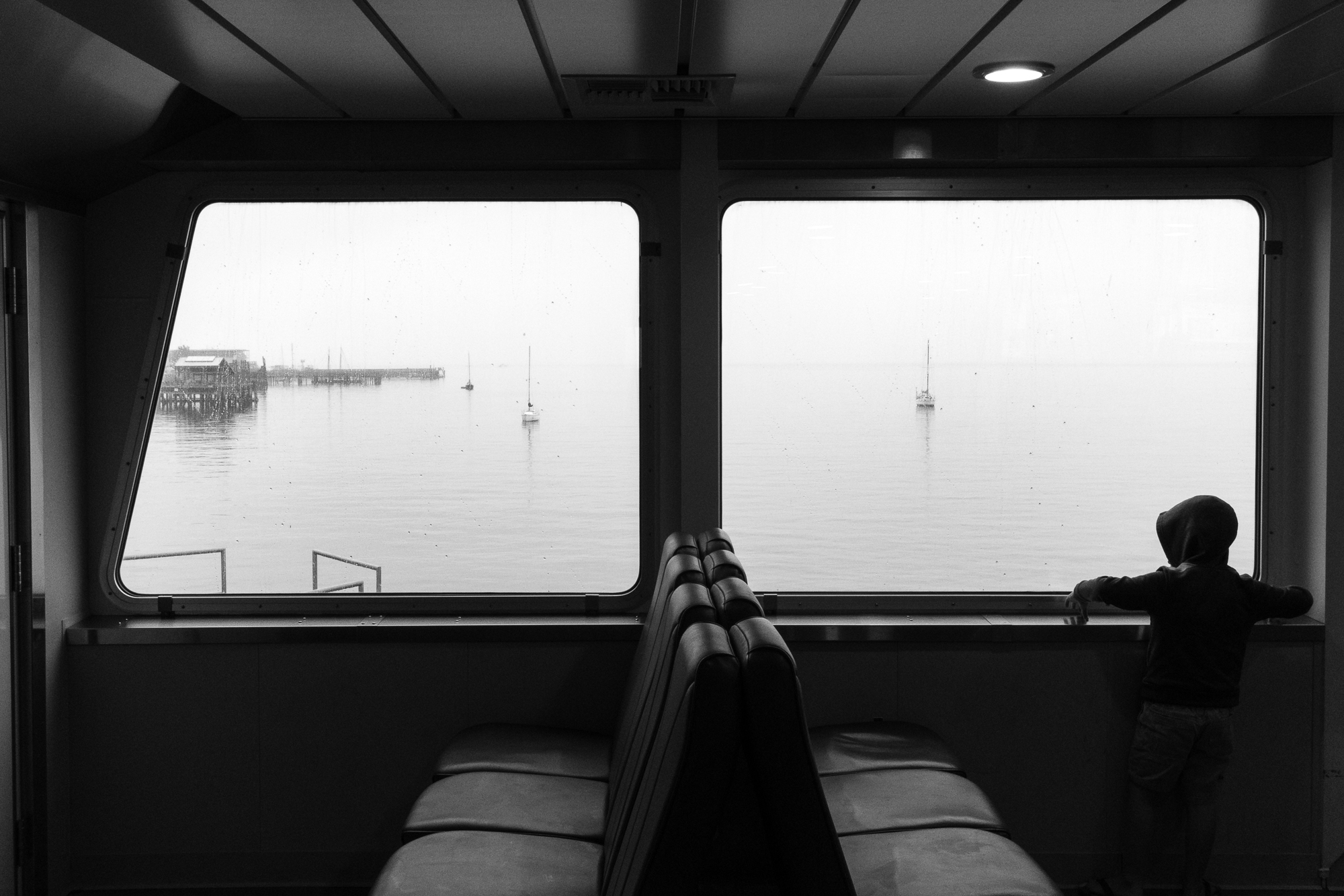 boy on ferry - documentary family photography