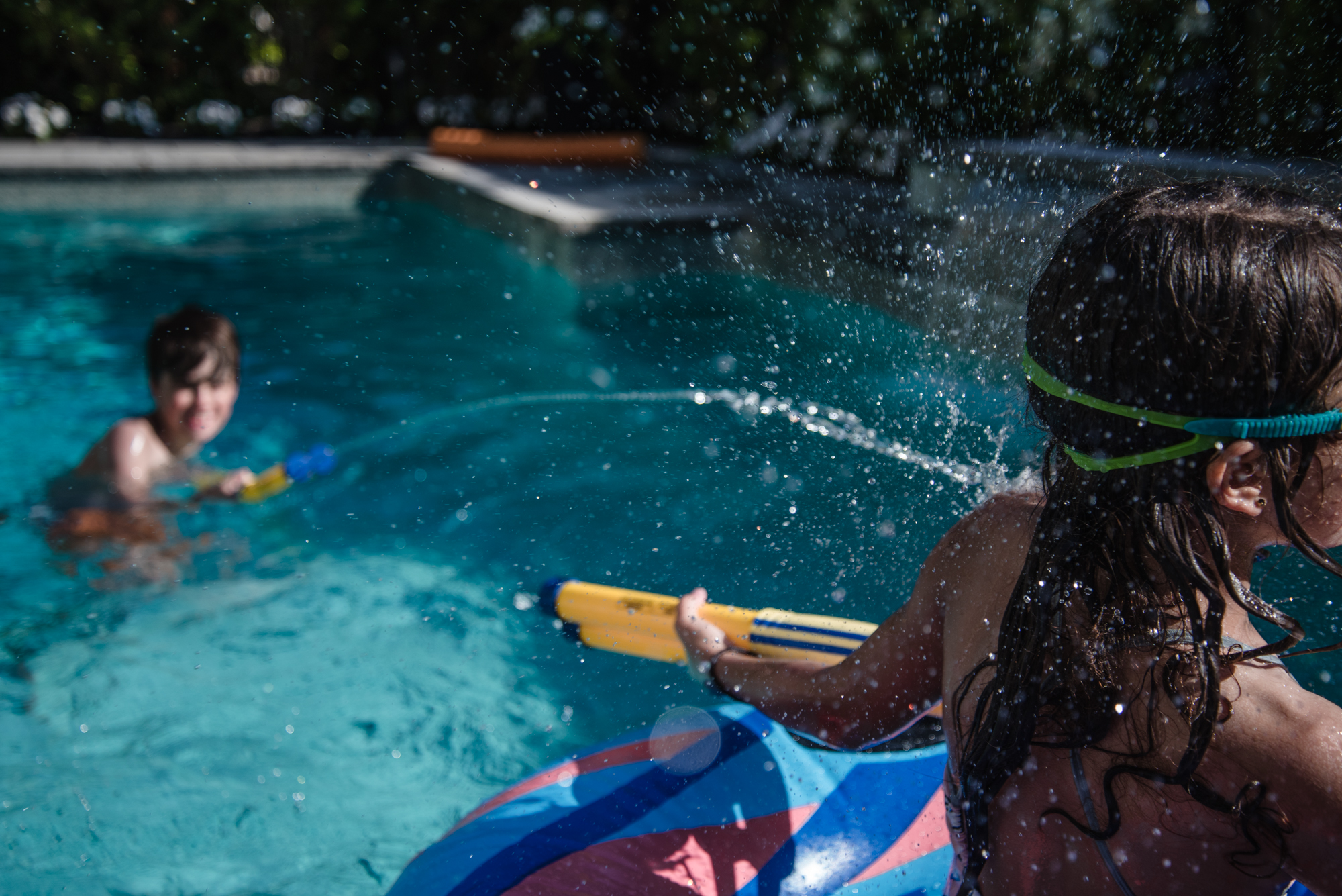 kids play in pool - documentary family photography