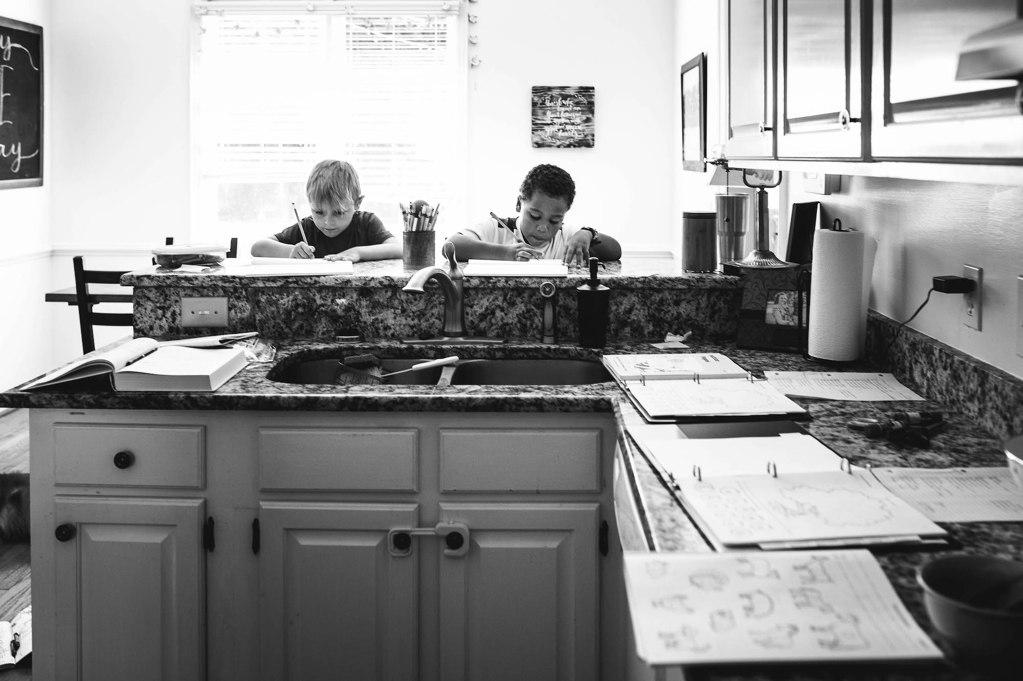 boys do homework in kitchen - Documentary Family Photography