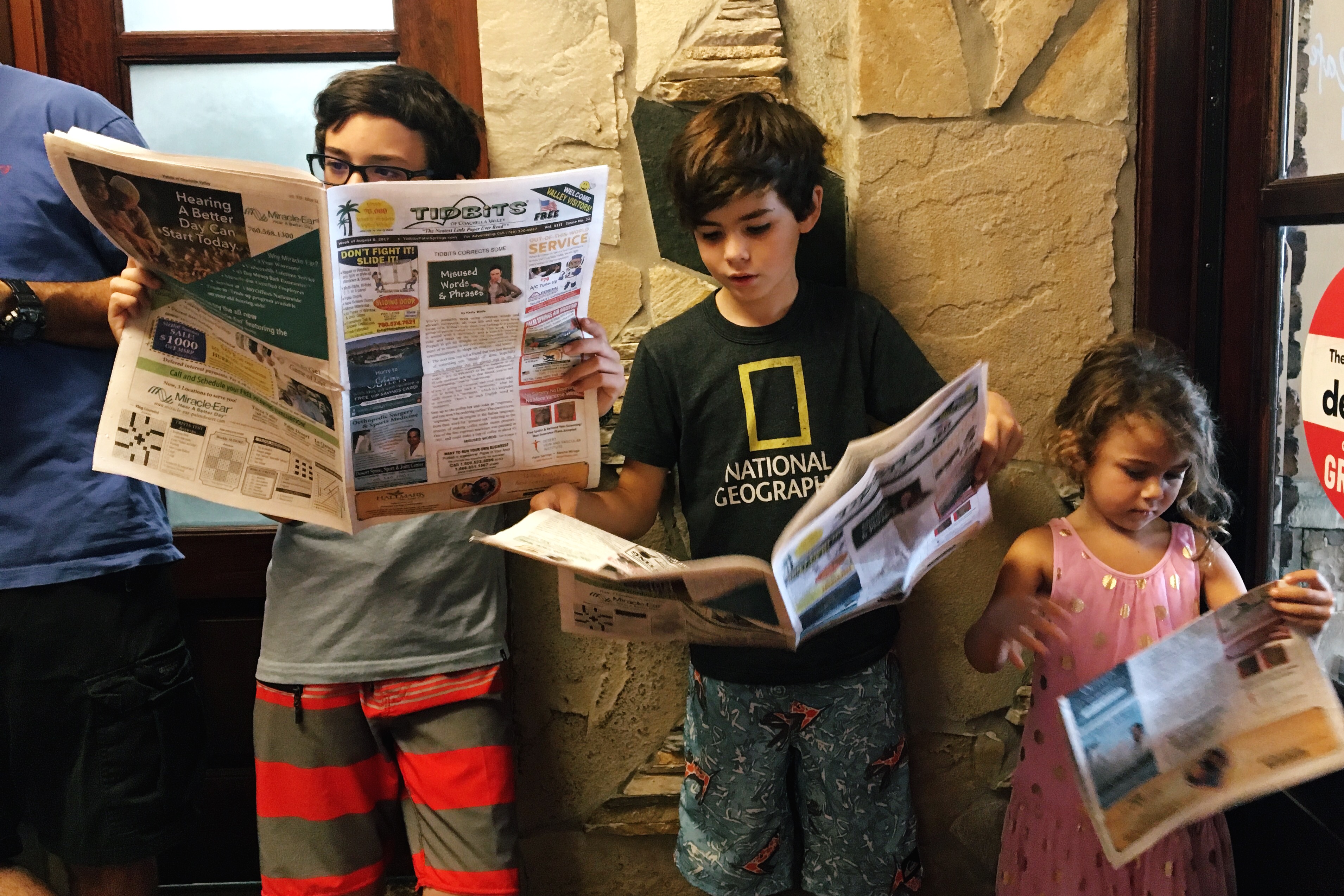 kids reading news paper - Documentary Family Photography