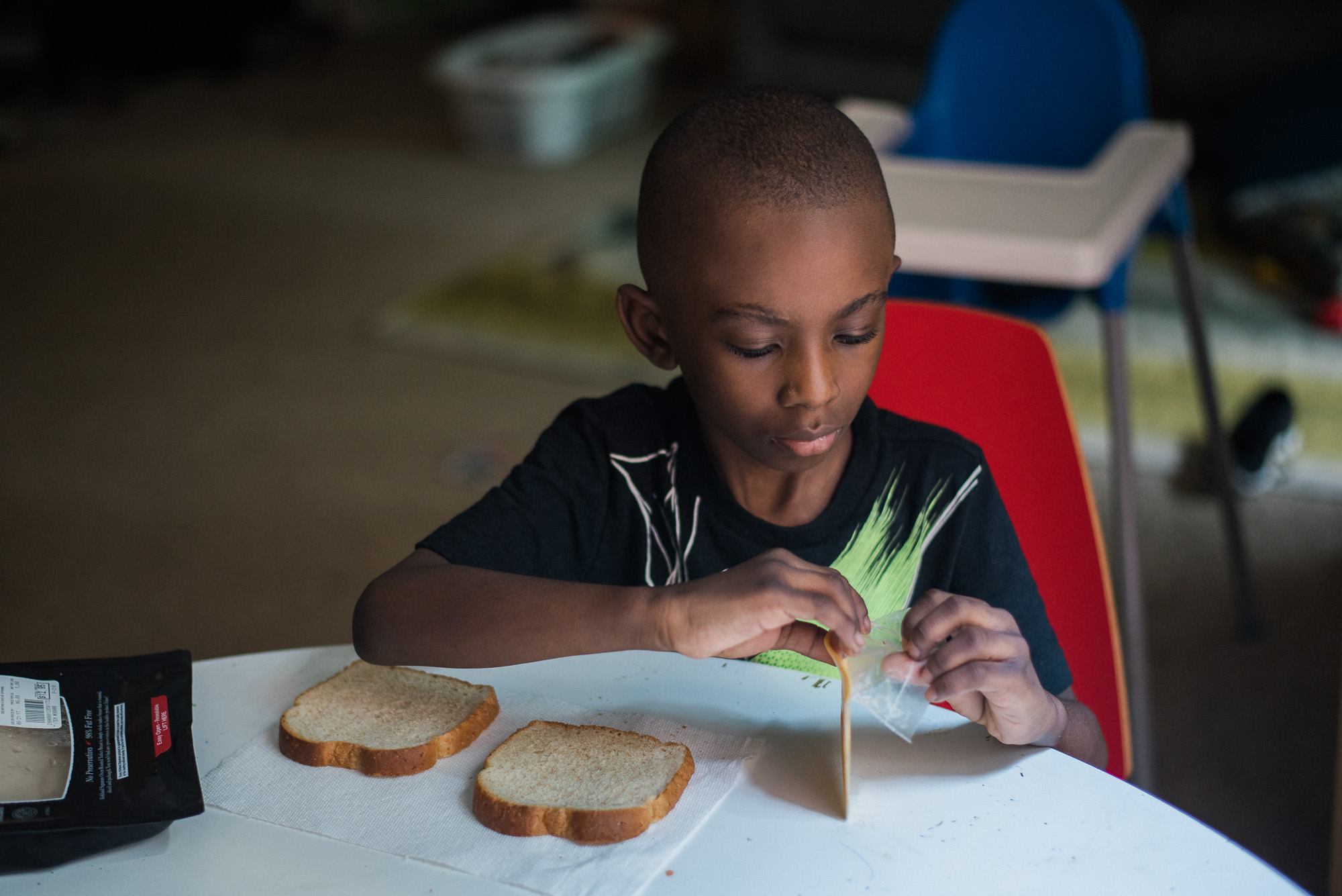 child making sandwich - documentary family photography