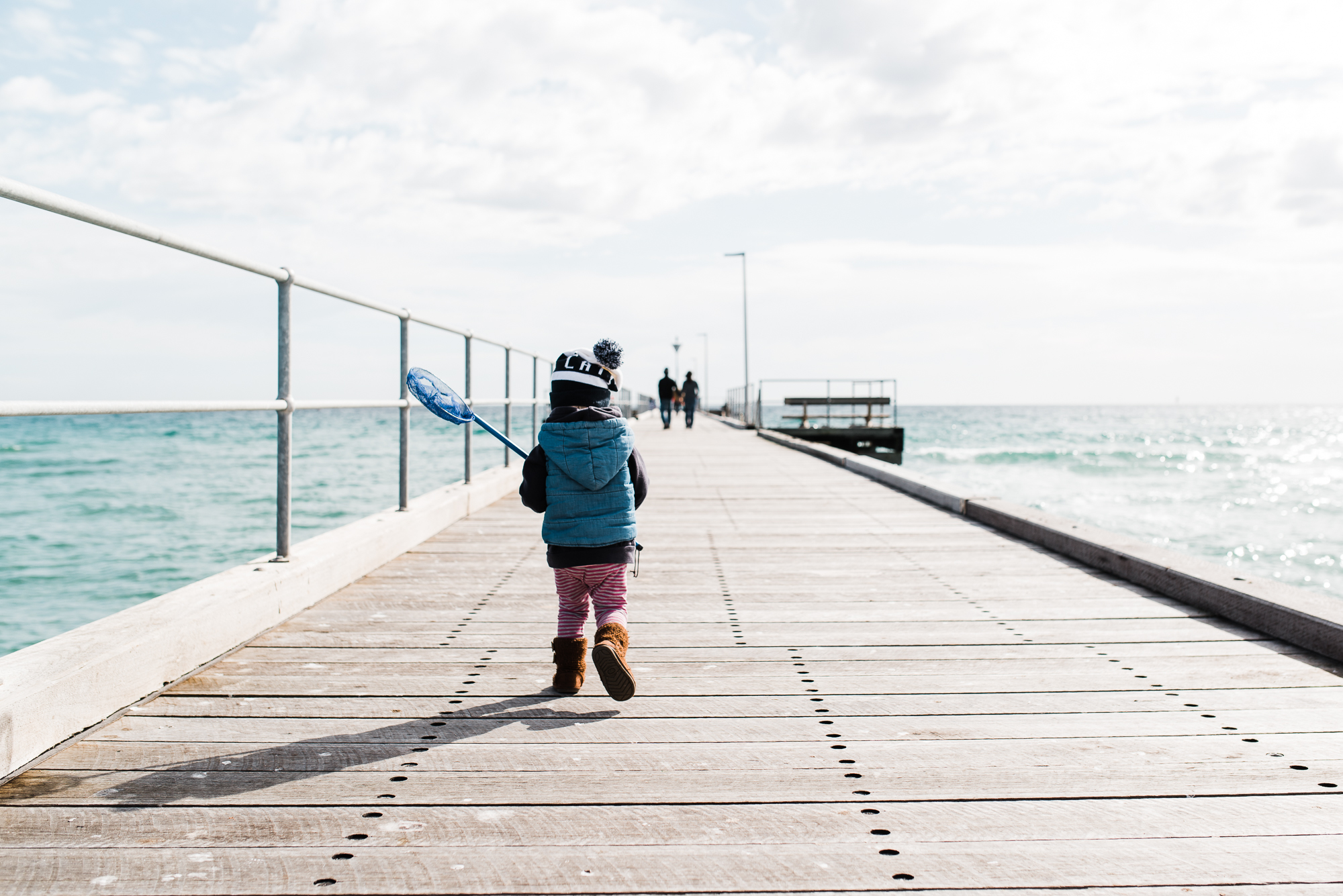 child on dock - documentary family photography
