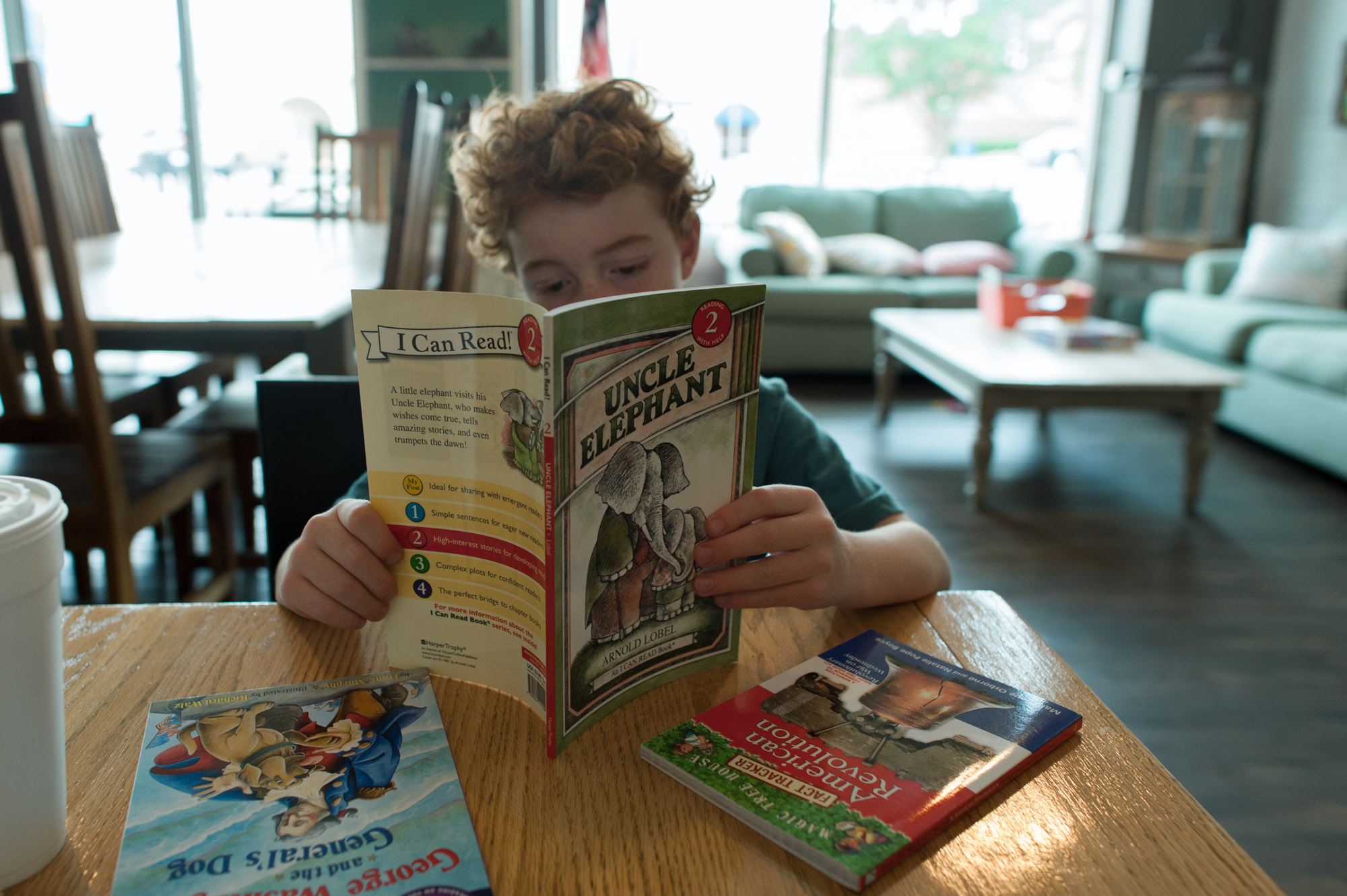 boy reading book - documentary family photography