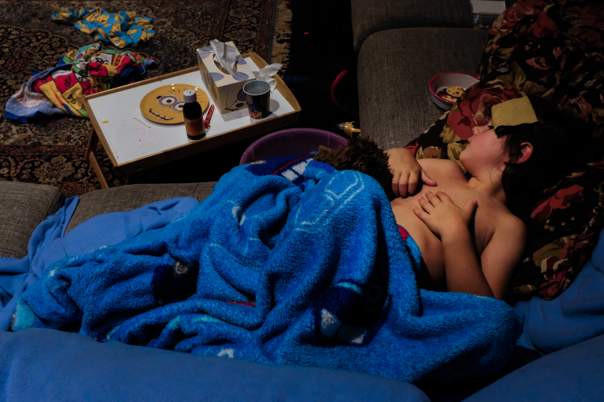 kid wrapped up on couch - Documentary Family Photography