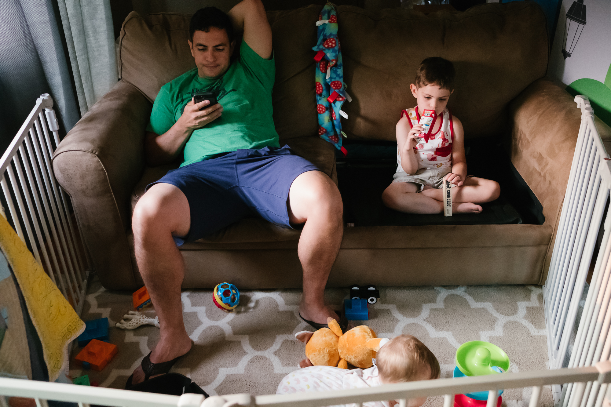 father and son on couch - Documentary Family Photography