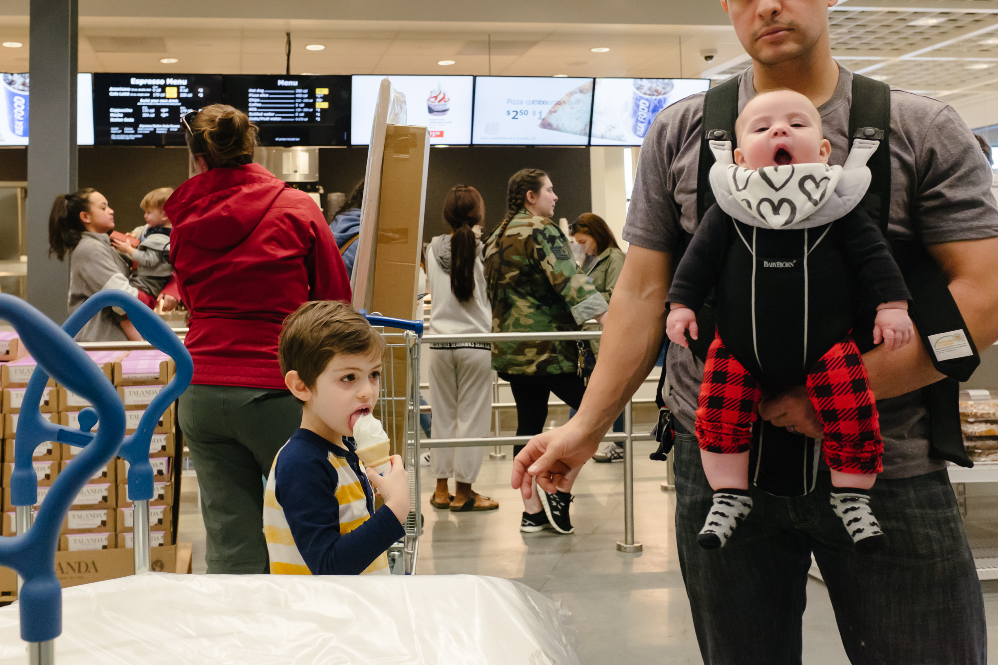 Erika Roa - boy eats ice cream while baby yawns at IKEA