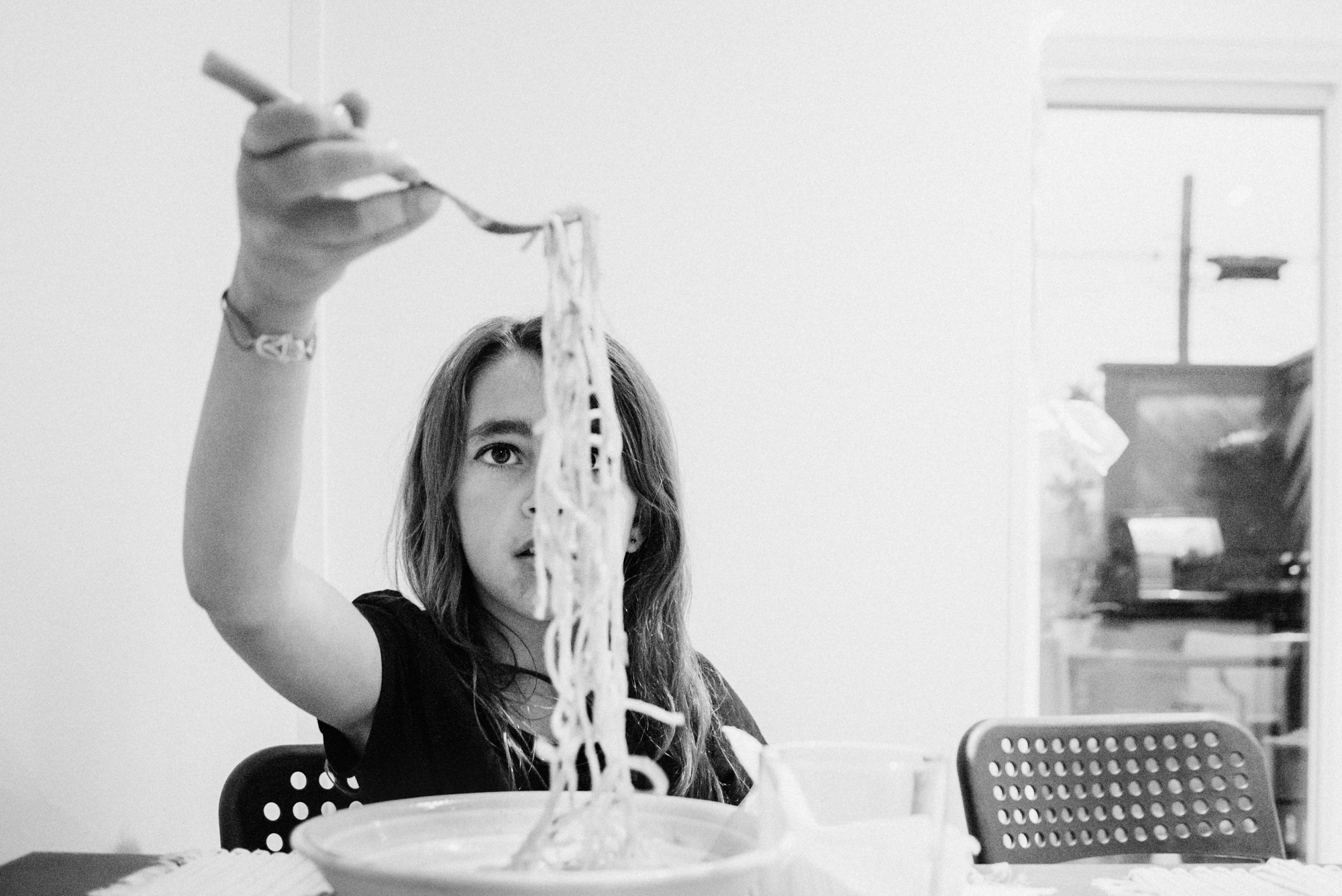 girl eats pasta - Documentary Family Photography