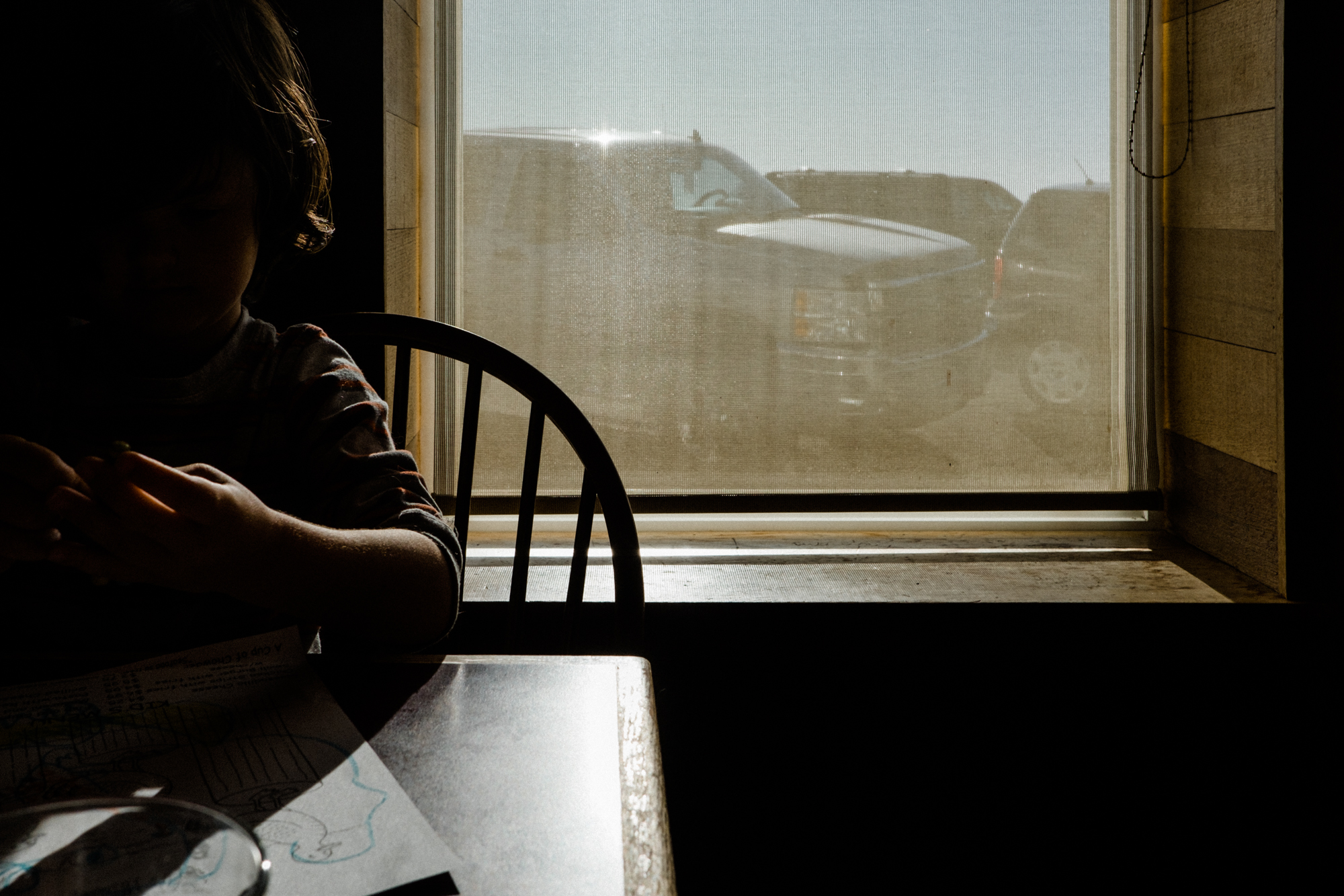 child with crayons at restaurant - Documentary Family Photography