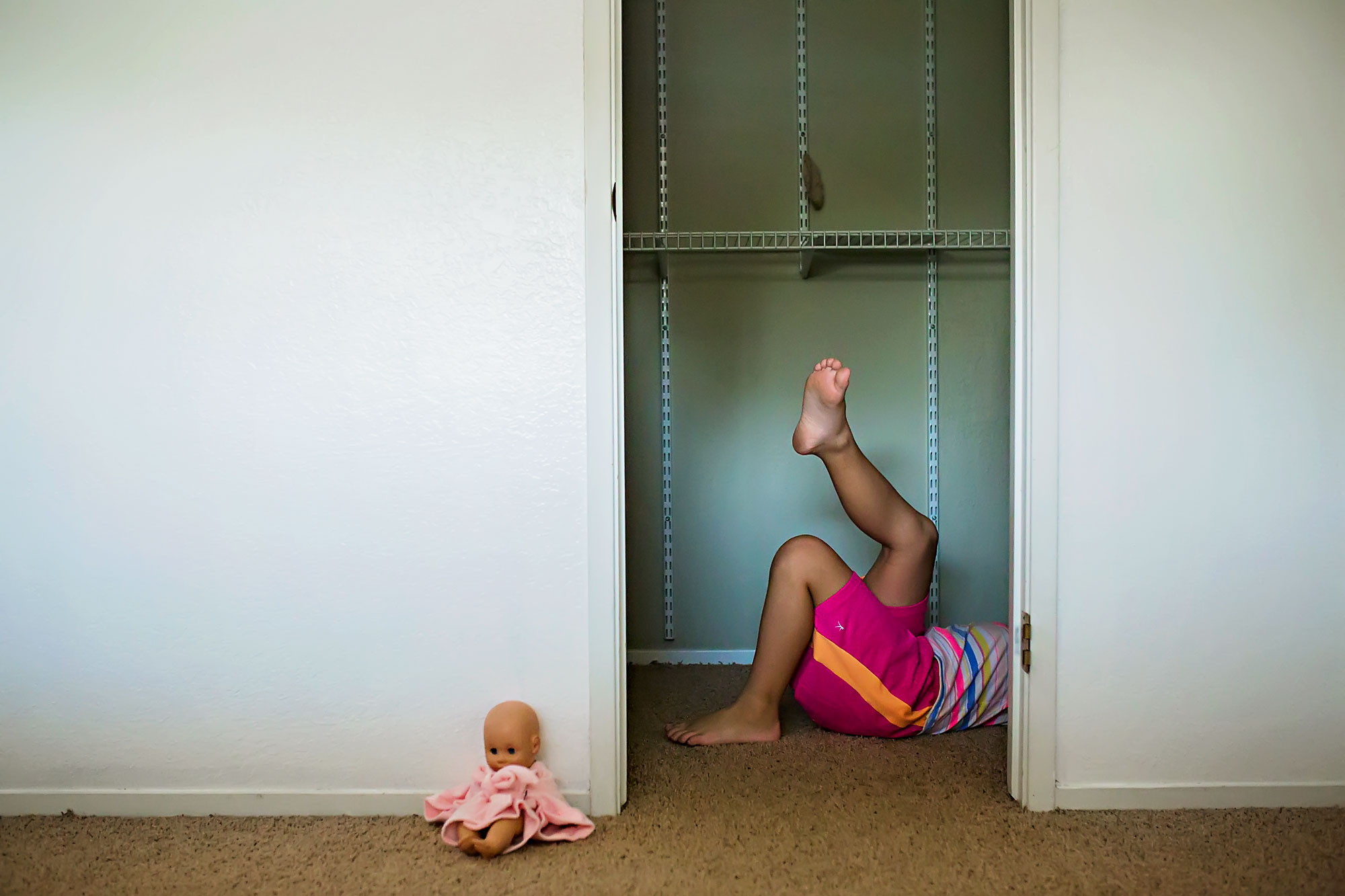 girl's feet from closet door - Documentary Family Photography