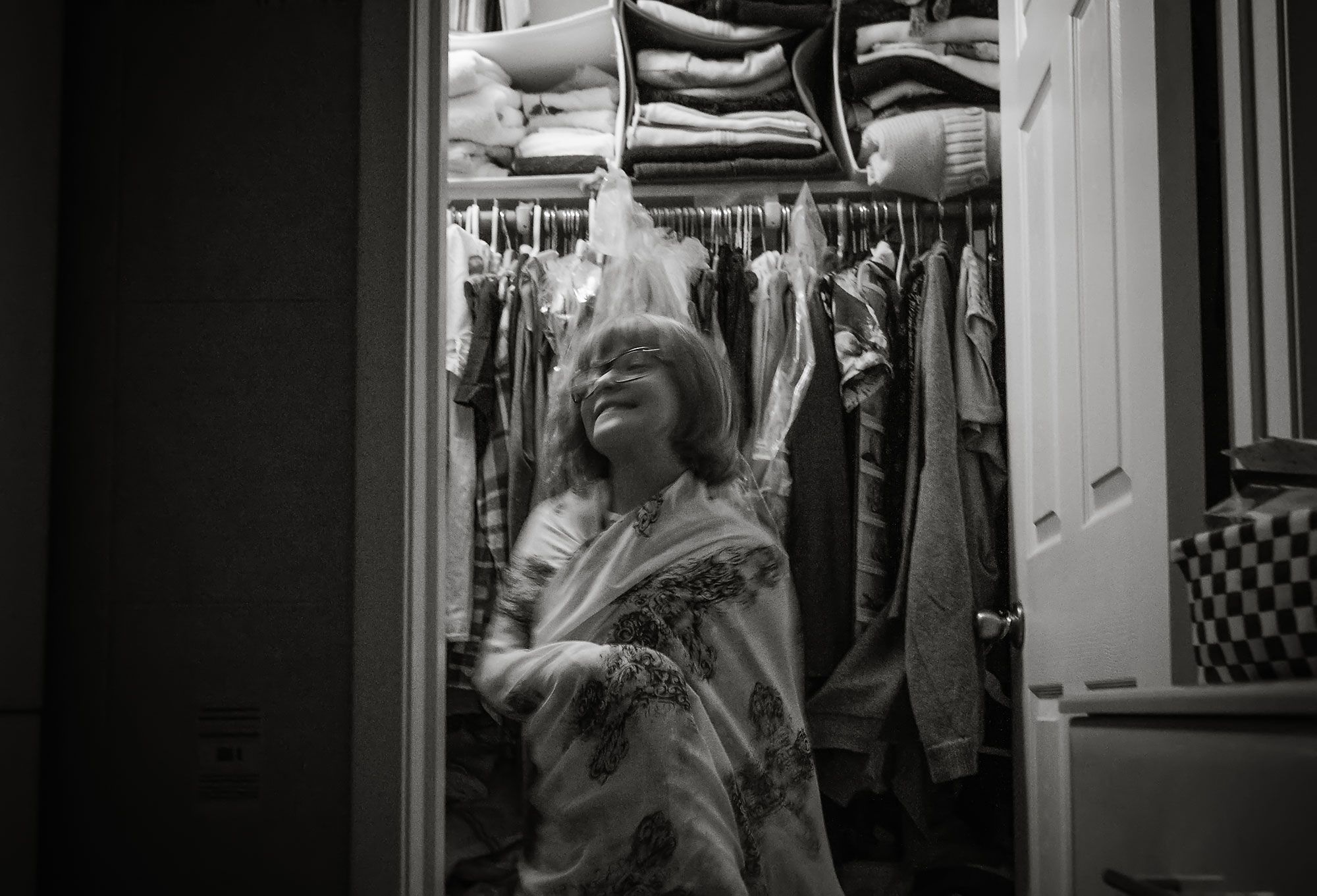 girl plays dress up in closet - Documentary Family Photography